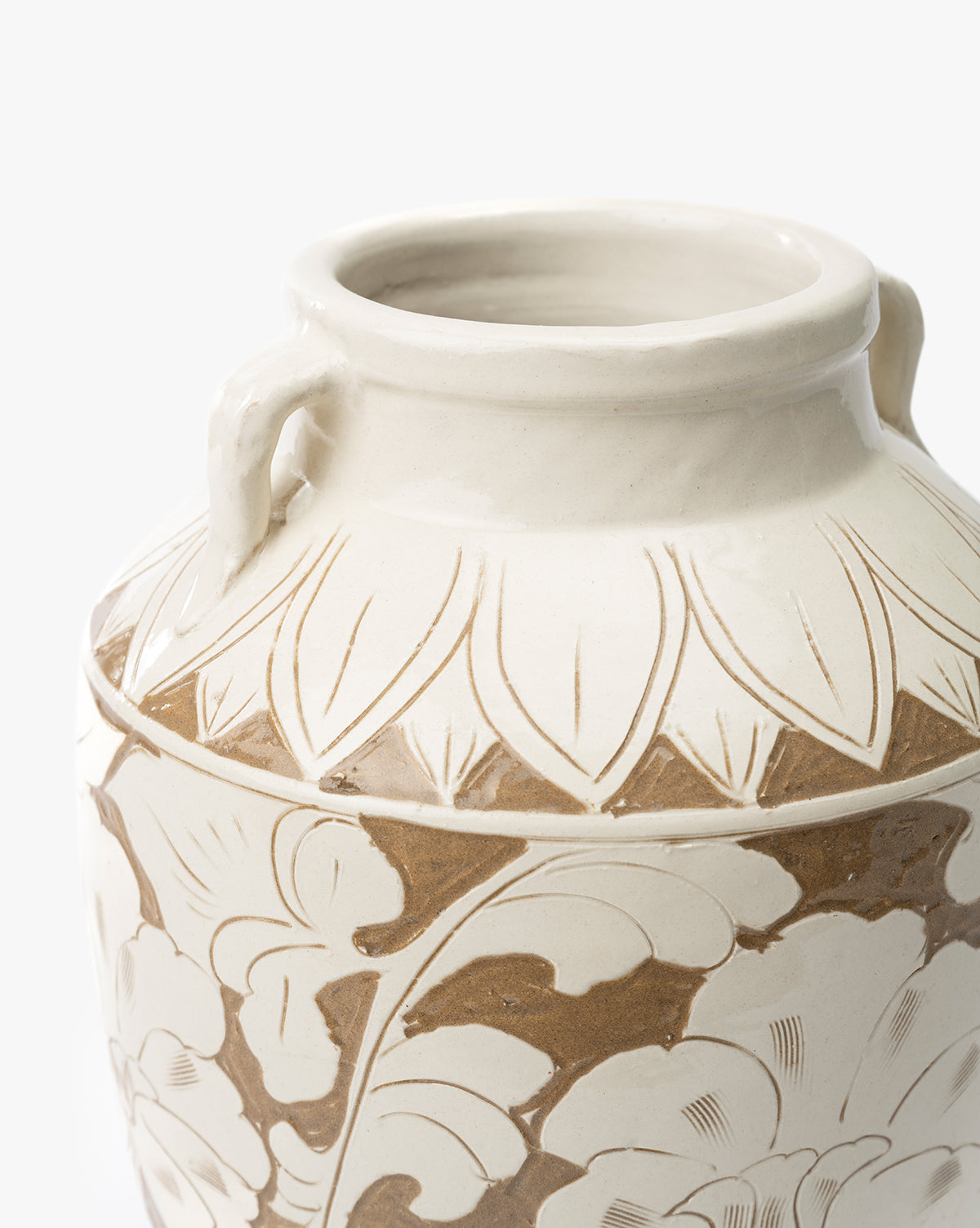 A close-up of the Blaise Vase, a vintage cream ceramic piece with small rim handles and engraved beige and brown floral patterns—perfect for adding unique style to your home decor, by McGee & Co.