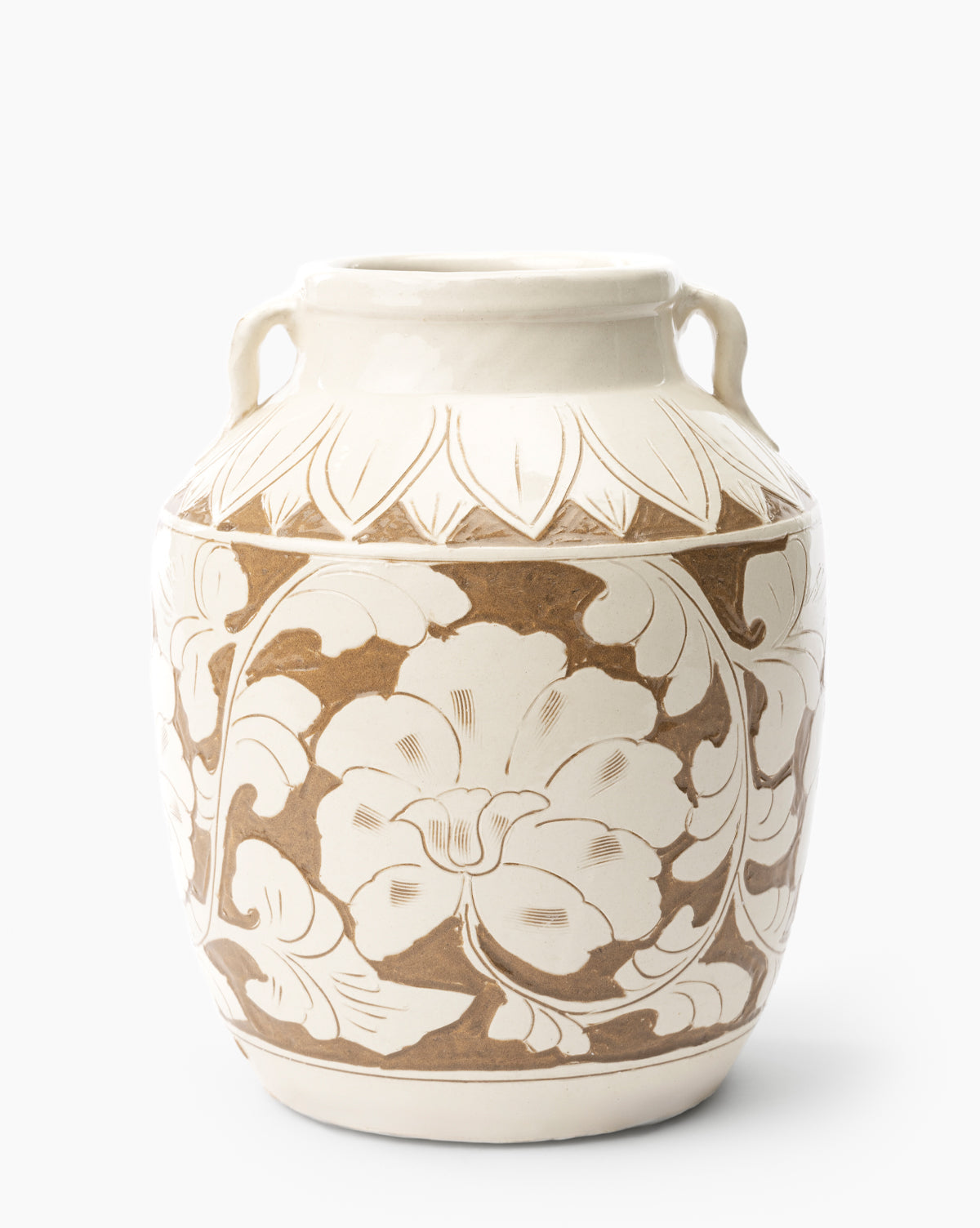 The Blaise Vase is a handmade ceramic piece with two small handles, a cream and brown floral design, and a glossy finish—perfect for adding charm to your home decor. Shown against a plain white background by McGee & Co.