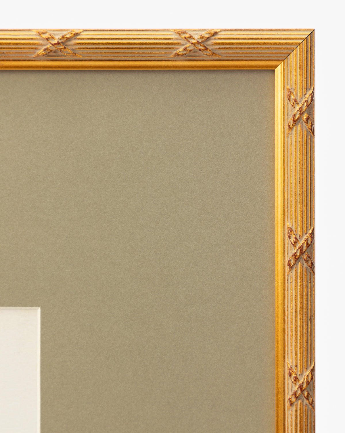Close-up of the top right corner of a gold-finished wood frame with a crisscross pattern around a beige mat. Ideal for showcasing Botanical Grid 3 giclee prints or gallery wall art. White background enhances the display by McGee & Co.