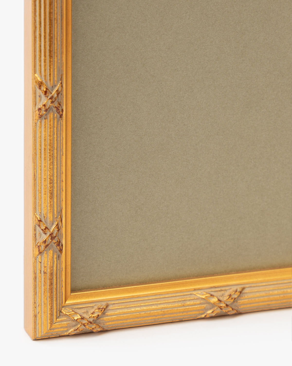 A close-up of the gold-finished wood frame with carved details on Botanical Grid 3, highlighting the elegant border around its beige background—ideal for displaying this gallery-quality wall art, by McGee & Co.