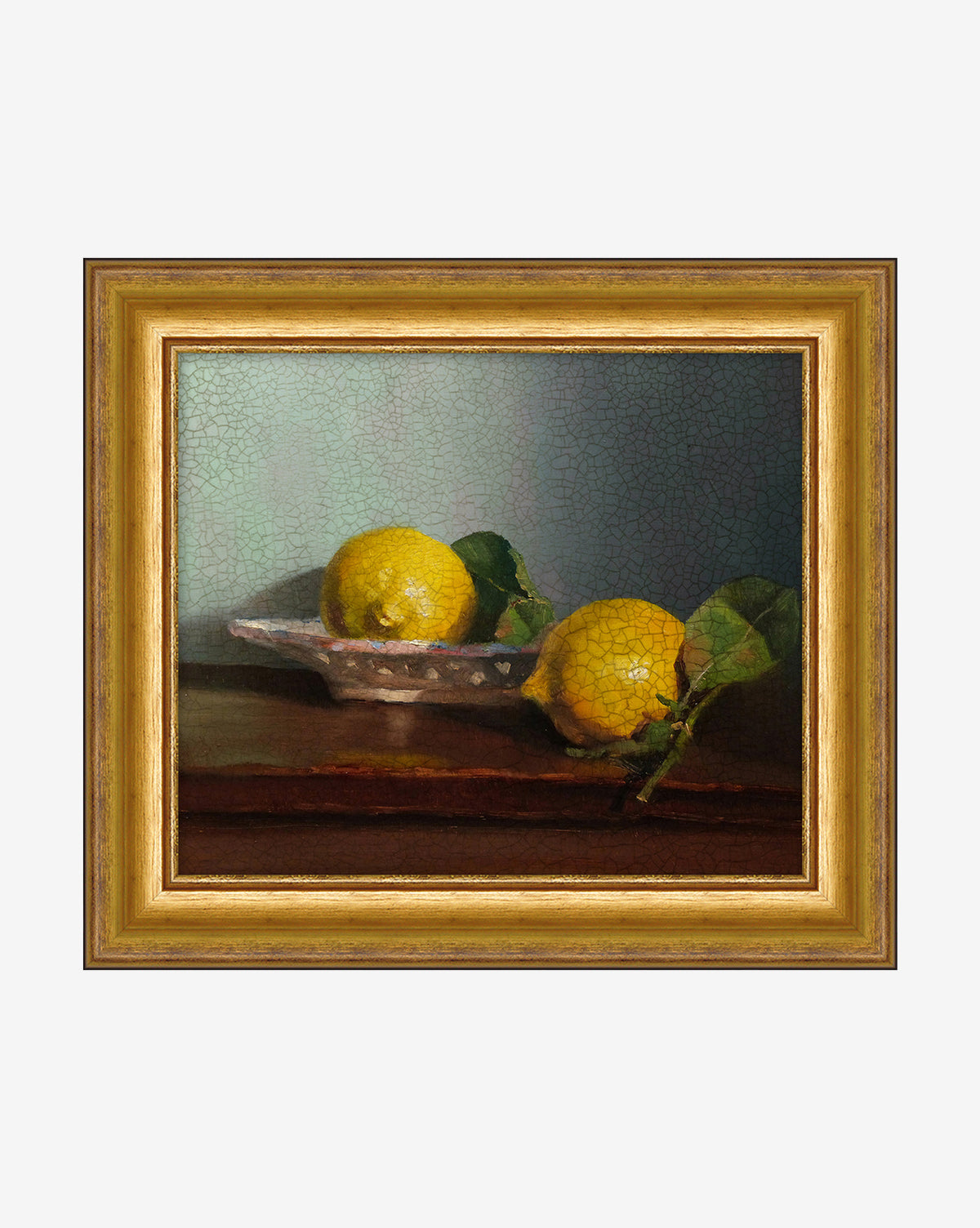 Bowl of Lemons framed art features two yellow lemons with green leaves on a glass dish, set against a soft blue-green background and brown tabletop—ideal vintage-inspired kitchen decor.