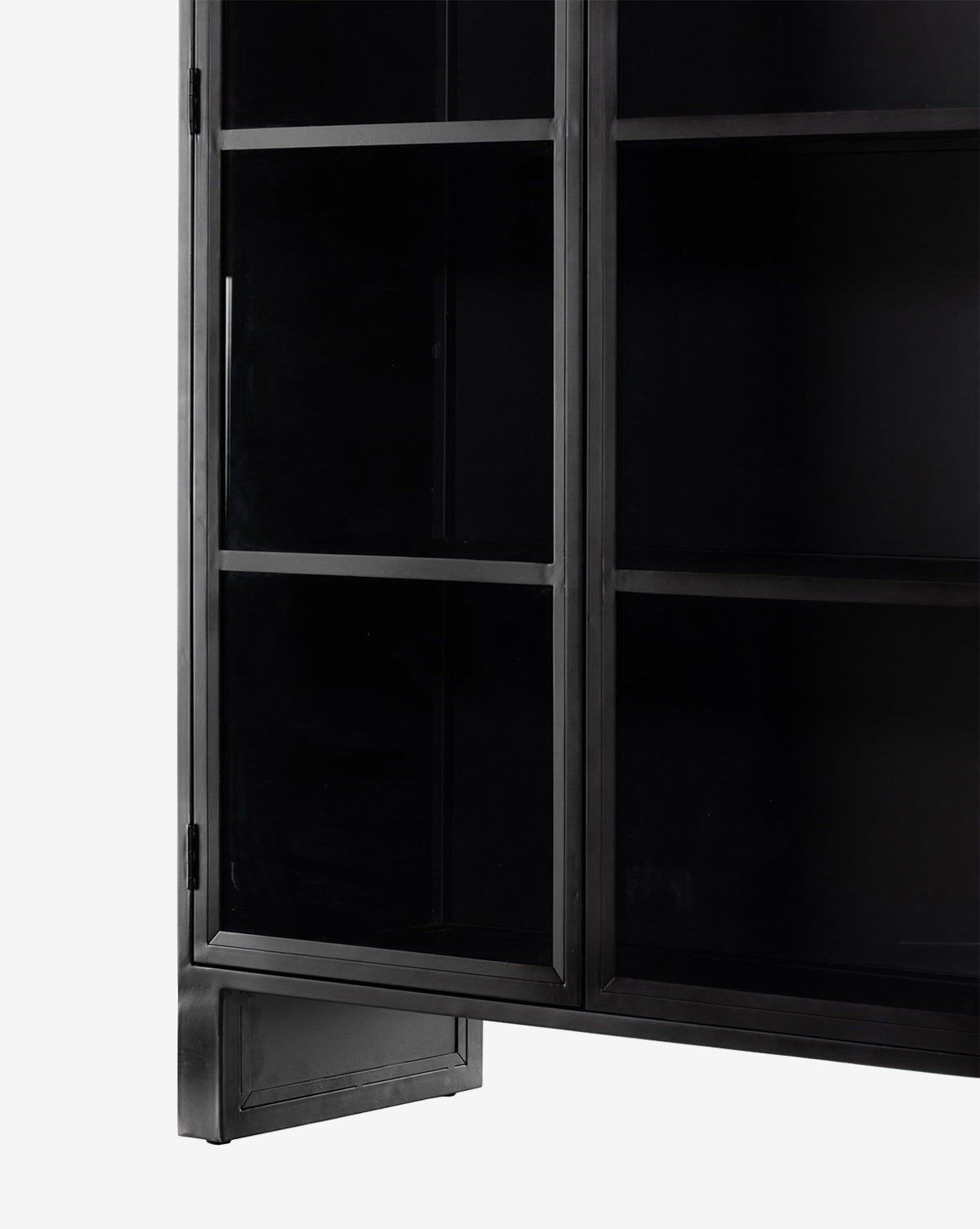 A close-up of the Brookes Cabinet, a stylish black iron piece with glass doors, vertical handle, and interior shelves, displayed against a plain white background, by McGee & Co.