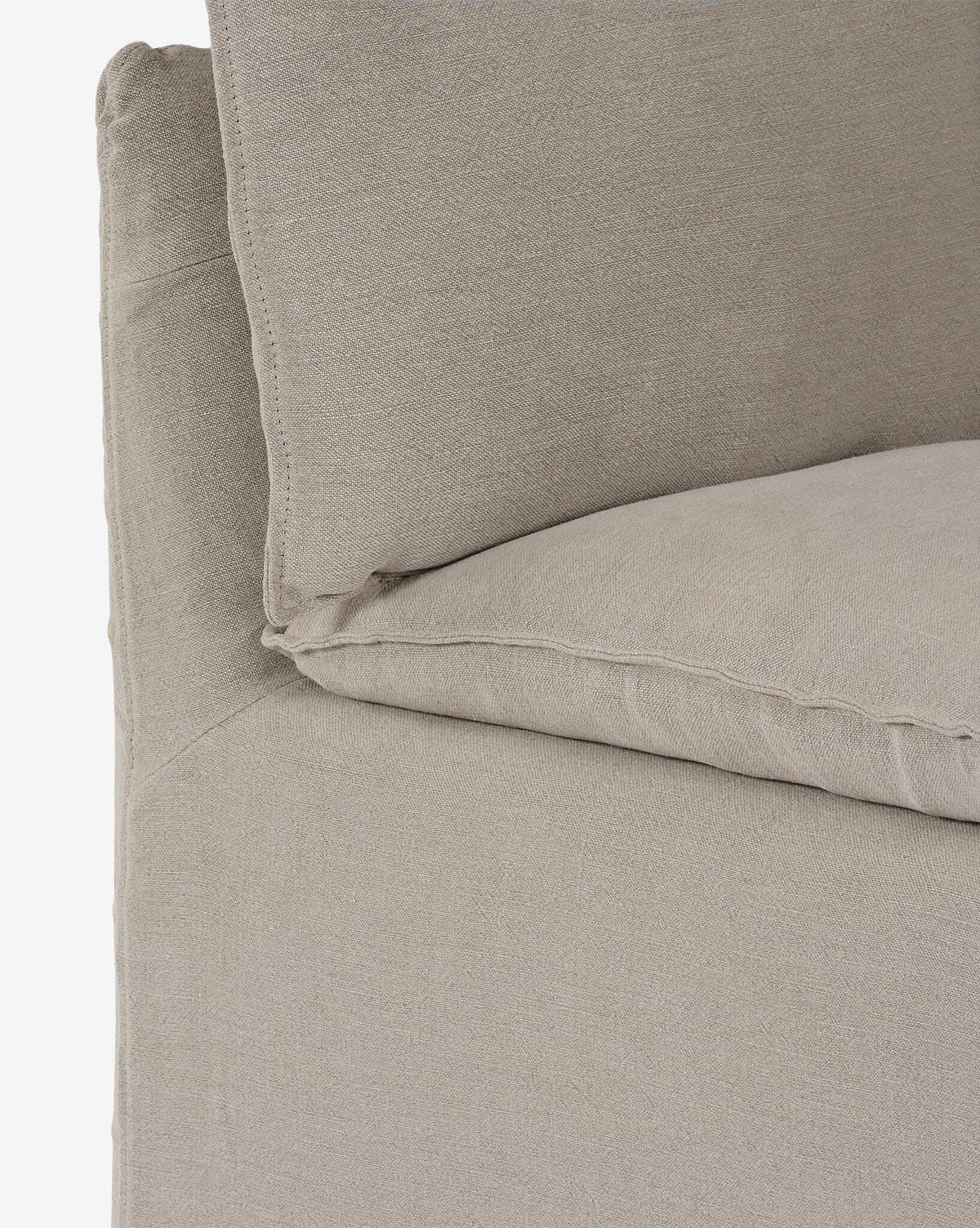 Close-up of the Brookings Slipcover Corner featuring plush cushions and soft, textured beige linen-blend upholstery for extra comfort, by McGee & Co.