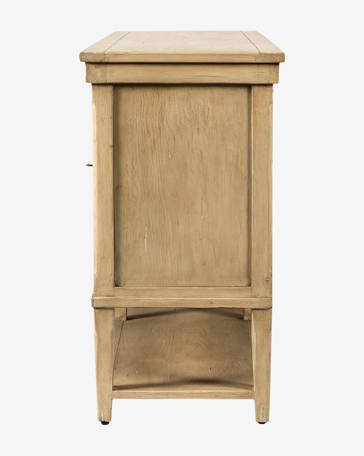 Side view of the Bryn Sideboard crafted from solid pine with a rectangular panel design, light natural finish, open lower shelf, four sturdy legs, and accented by distressed copper hardware for added character, by McGee & Co.