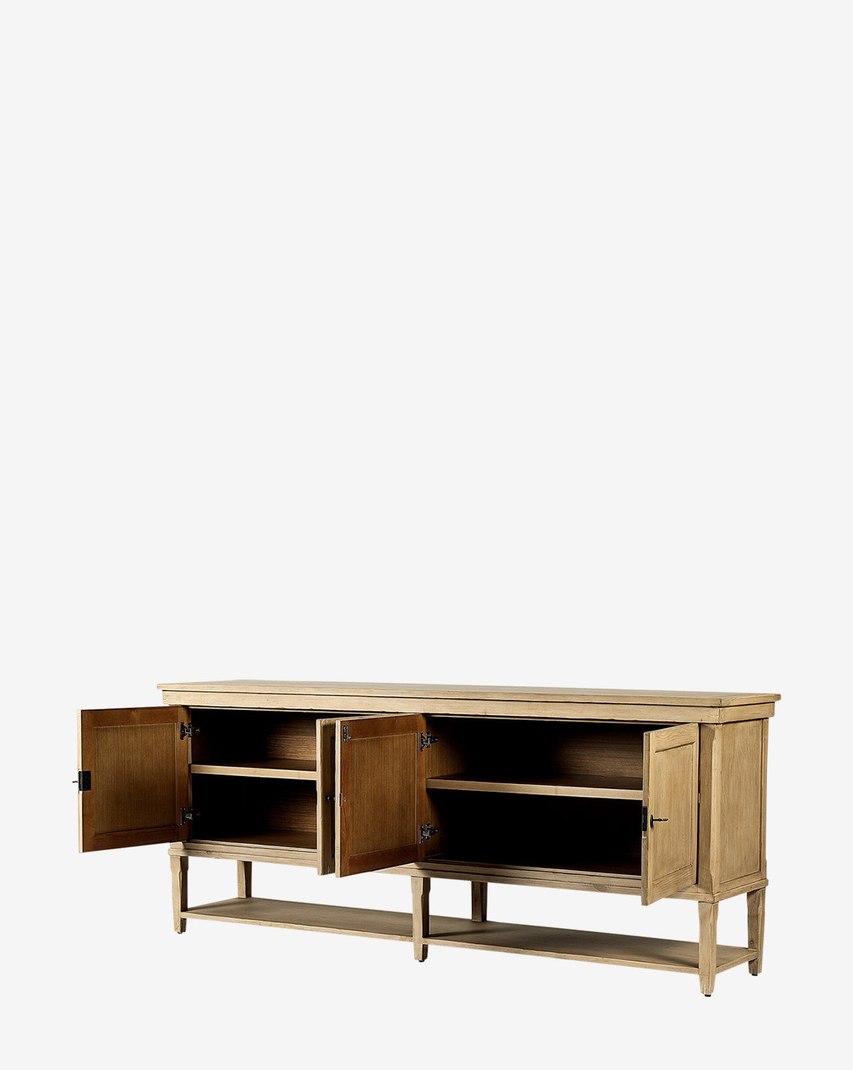 The Bryn Sideboard is a rustic piece crafted from solid pine, featuring three open cabinet doors that reveal spacious shelves. Finished in natural wood with distressed copper hardware, it stands on four legs against a plain white background by McGee & Co.