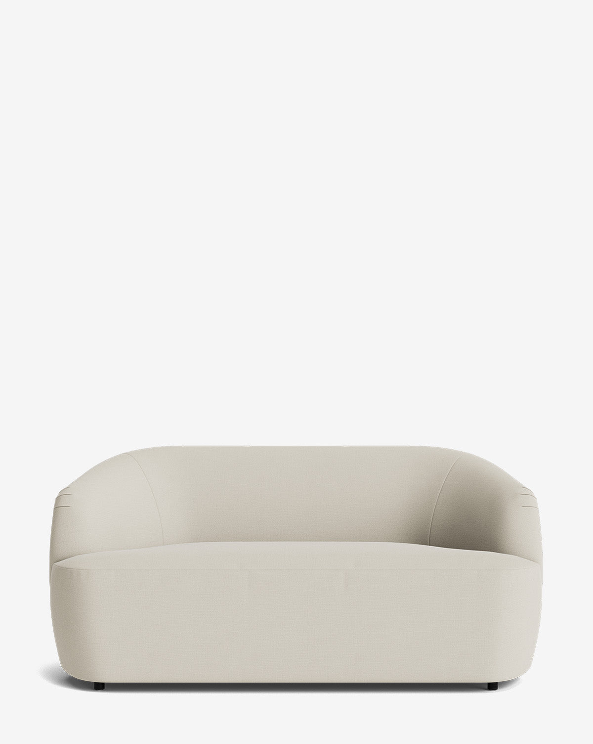 A modern, minimalist Byron Settee 68 in light beige with rounded edges and smooth cushions, set against a plain white background by McGee & Co.