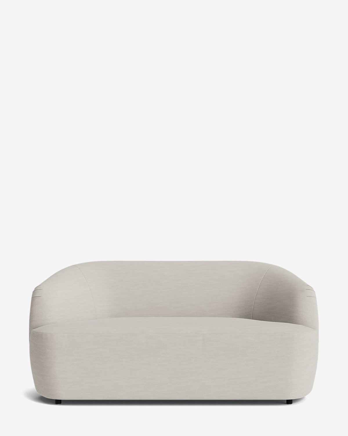 A modern Byron Settee 68 in light beige, featuring a low backrest and rounded edges, set against a plain white background, by McGee & Co.
