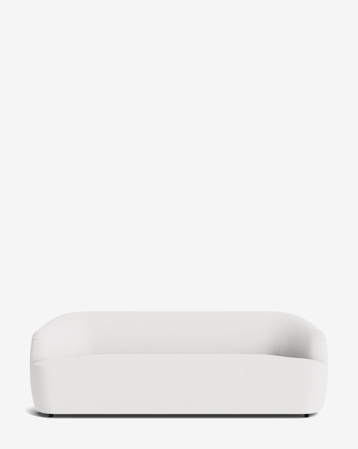 The Byron Sofa 96 features a modern, minimalist design with rounded edges and a low backrest, shown against a plain white background by McGee & Co.