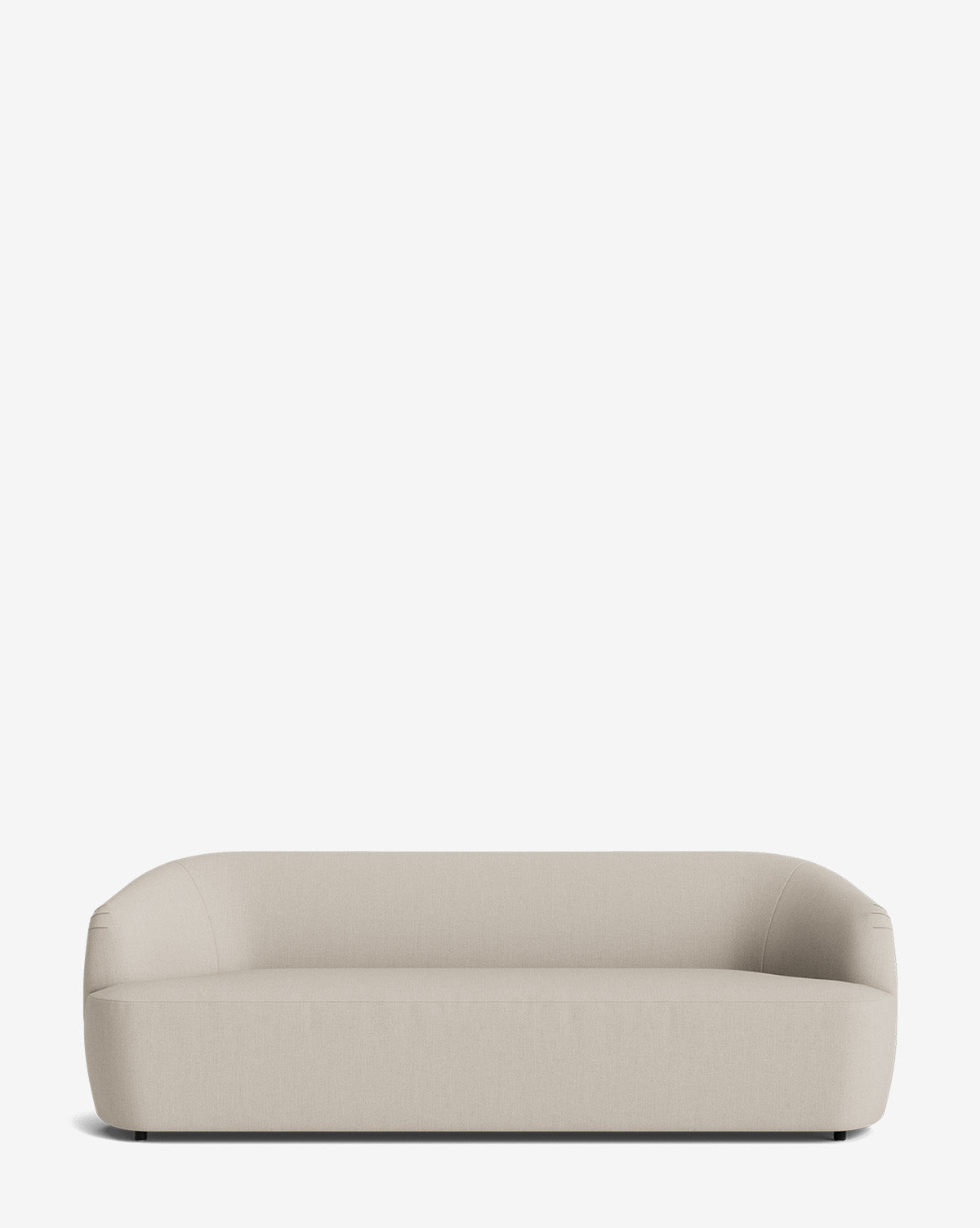 The Byron Sofa 96 showcases a modern, minimalist design with smooth, rounded edges, a low profile, and a curved back in custom fabric, displayed on a plain white background by McGee & Co.