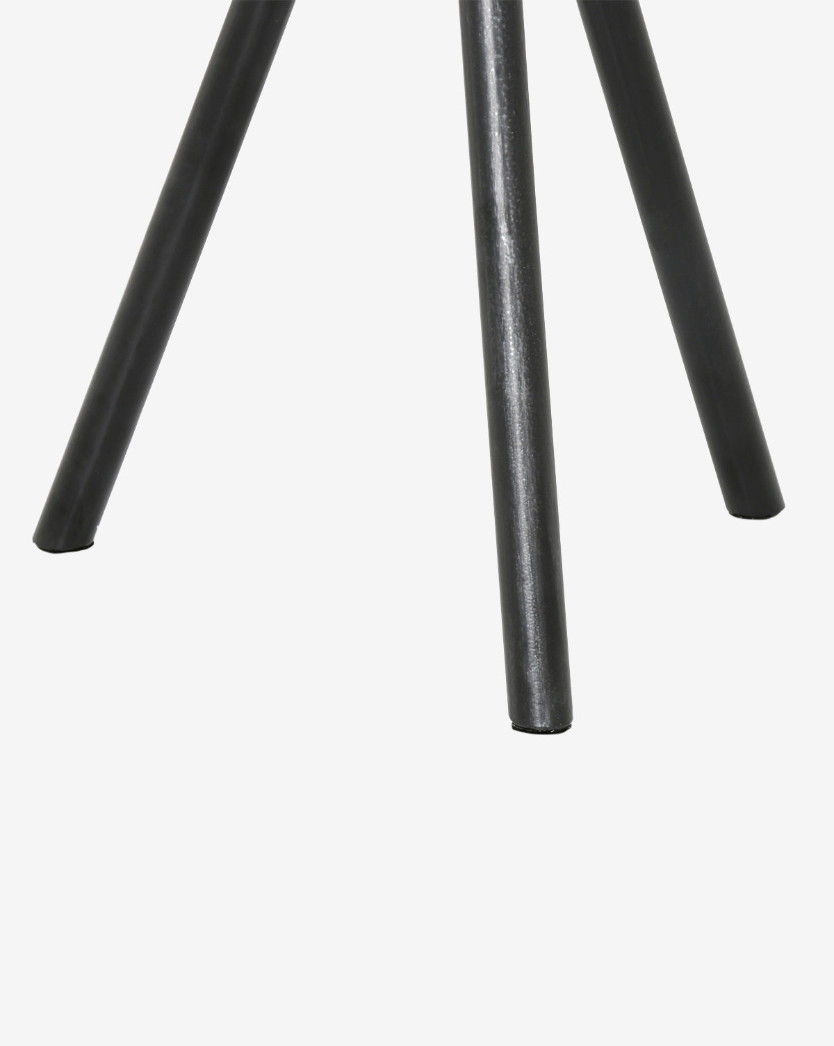 Close-up of the Caleb Side Table’s black metal tripod base on a white background—a sleek, modern accent for any room.