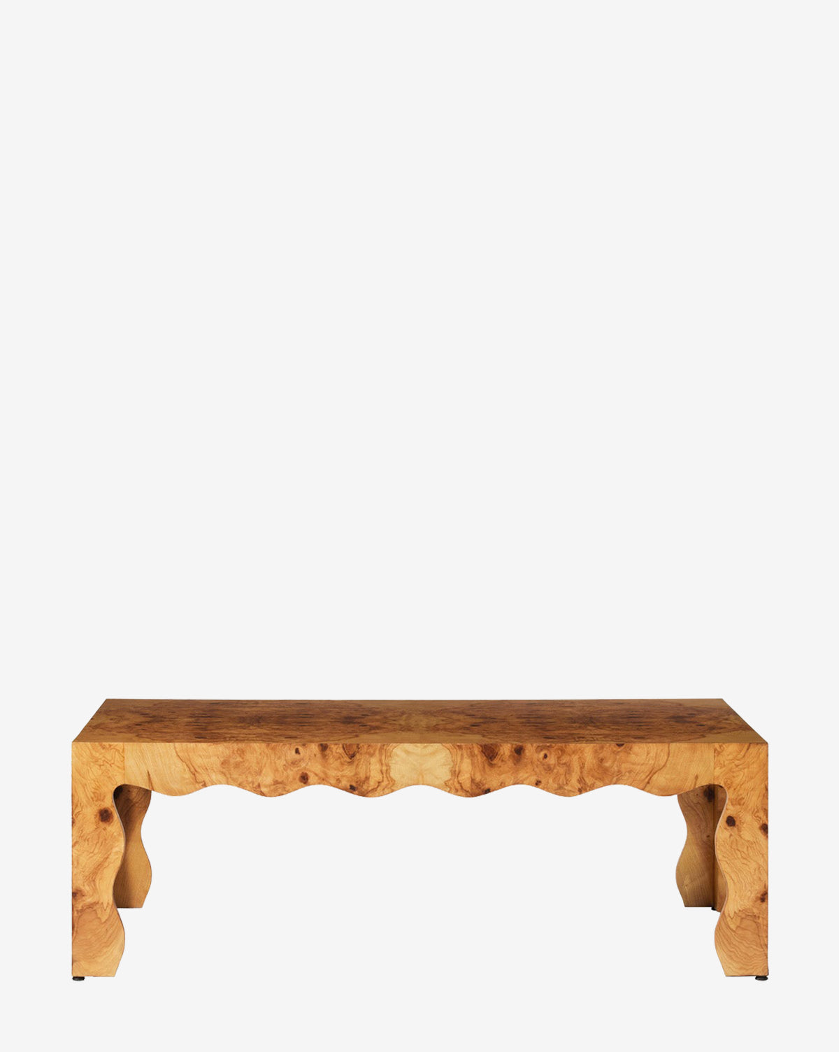 The Celeste Coffee Table showcases a rectangular wooden seat with a natural finish and distinct wavy, sculpted legs and apron, combining elegance with artistry, by McGee & Co. Photographed against a crisp white background.