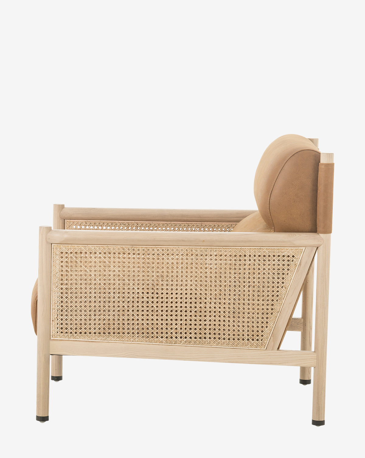Side view of the Channing Lounge Chair, showcasing Parisian-inspired design with woven rattan panels, high-performance upholstery on the seat and backrest, and a light wood minimalist frame set against a white background, by McGee & Co.