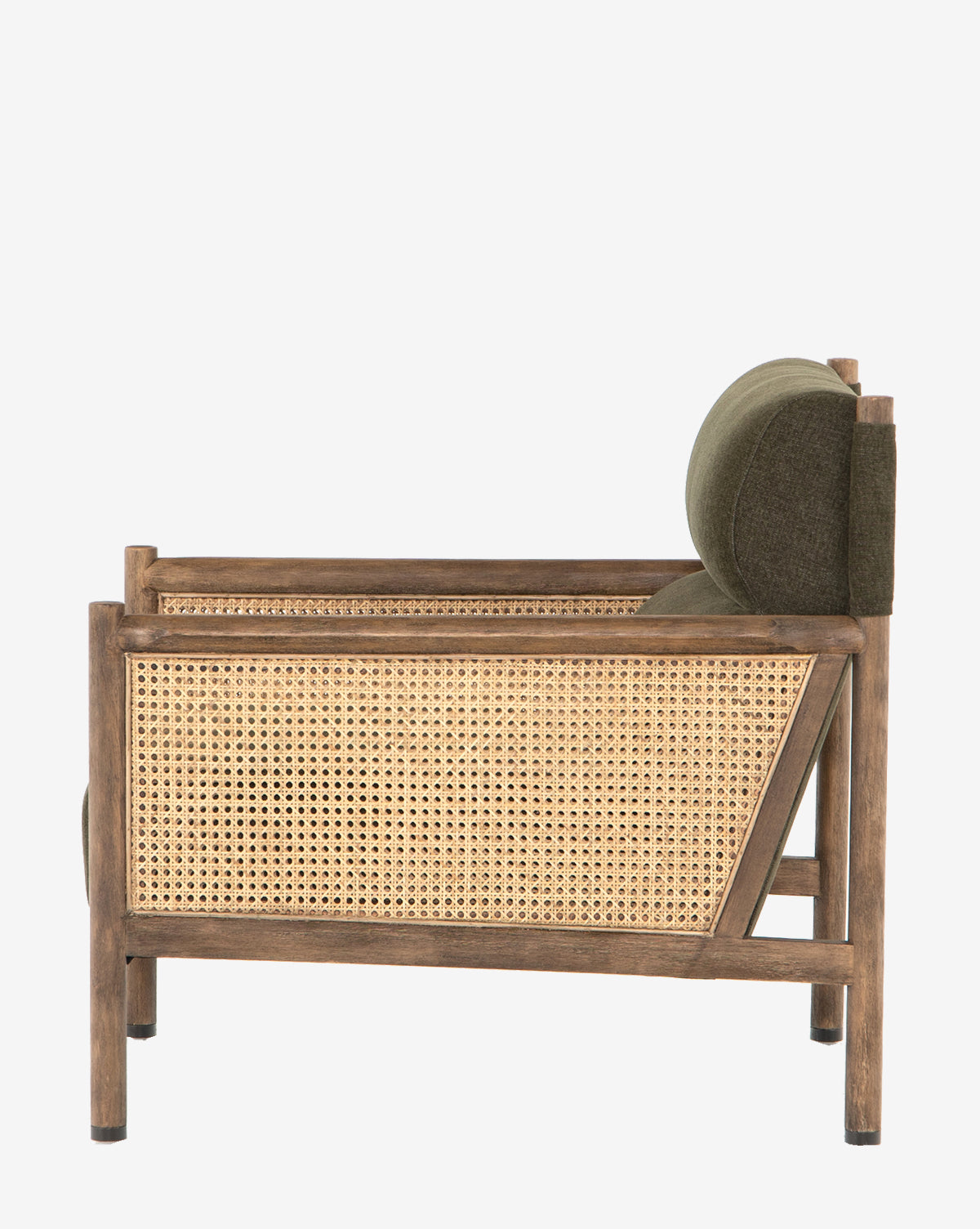 A side view of the Channing Lounge Chair, featuring a woven cane panel and high-performance dark green upholstered seat, blends classic and modern styles with Parisian elegance, by McGee & Co.