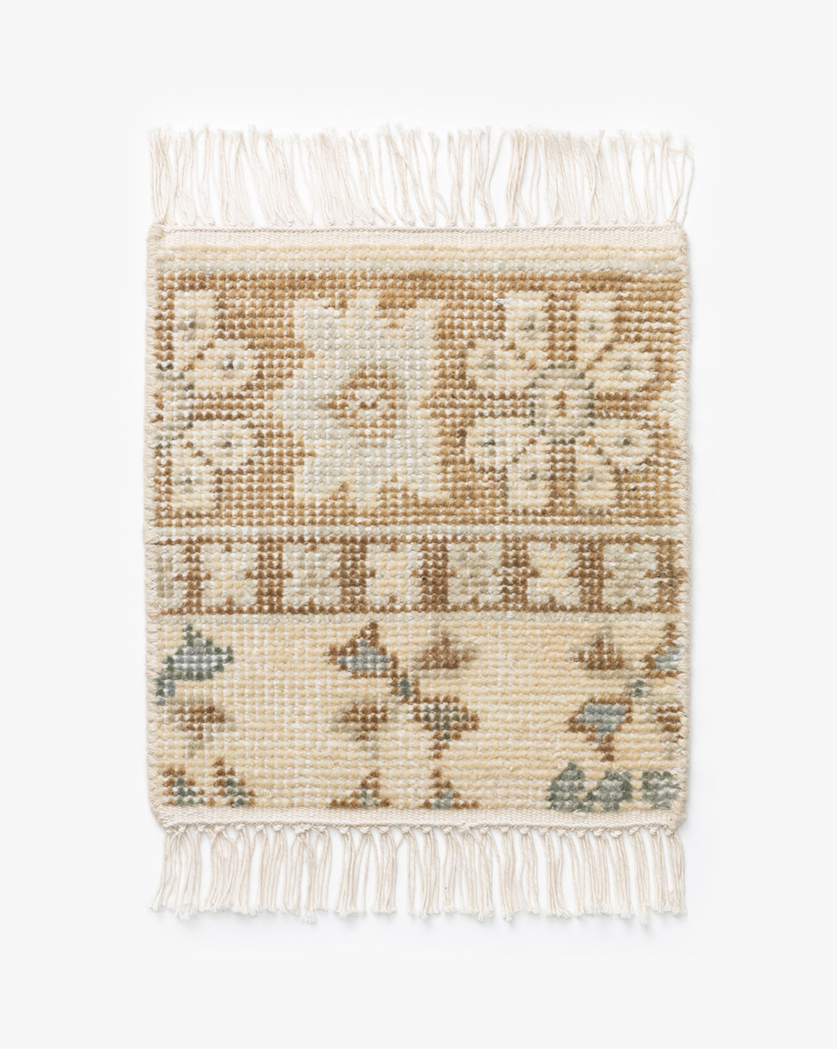 The Chantry Hand-Knotted Wool Rug Swatch features a square shape, natural cream, beige, and brown tones in geometric and floral patterns, and fringe on the top and bottom edges, by McGee & Co.