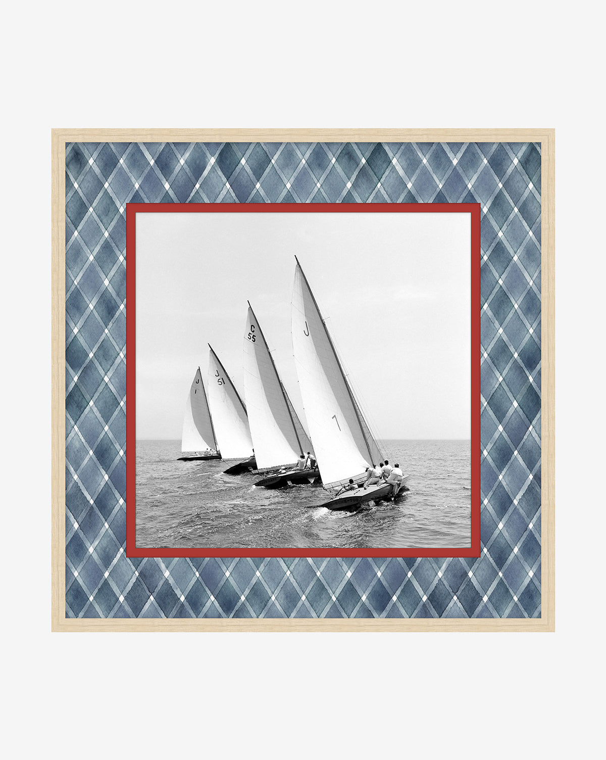 Chasing the Wind is a black-and-white giclée print of four sailboats racing, framed by a red border and blue plaid mat in a light wooden frame—ideal wall art for coastal decor, by McGee & Co.