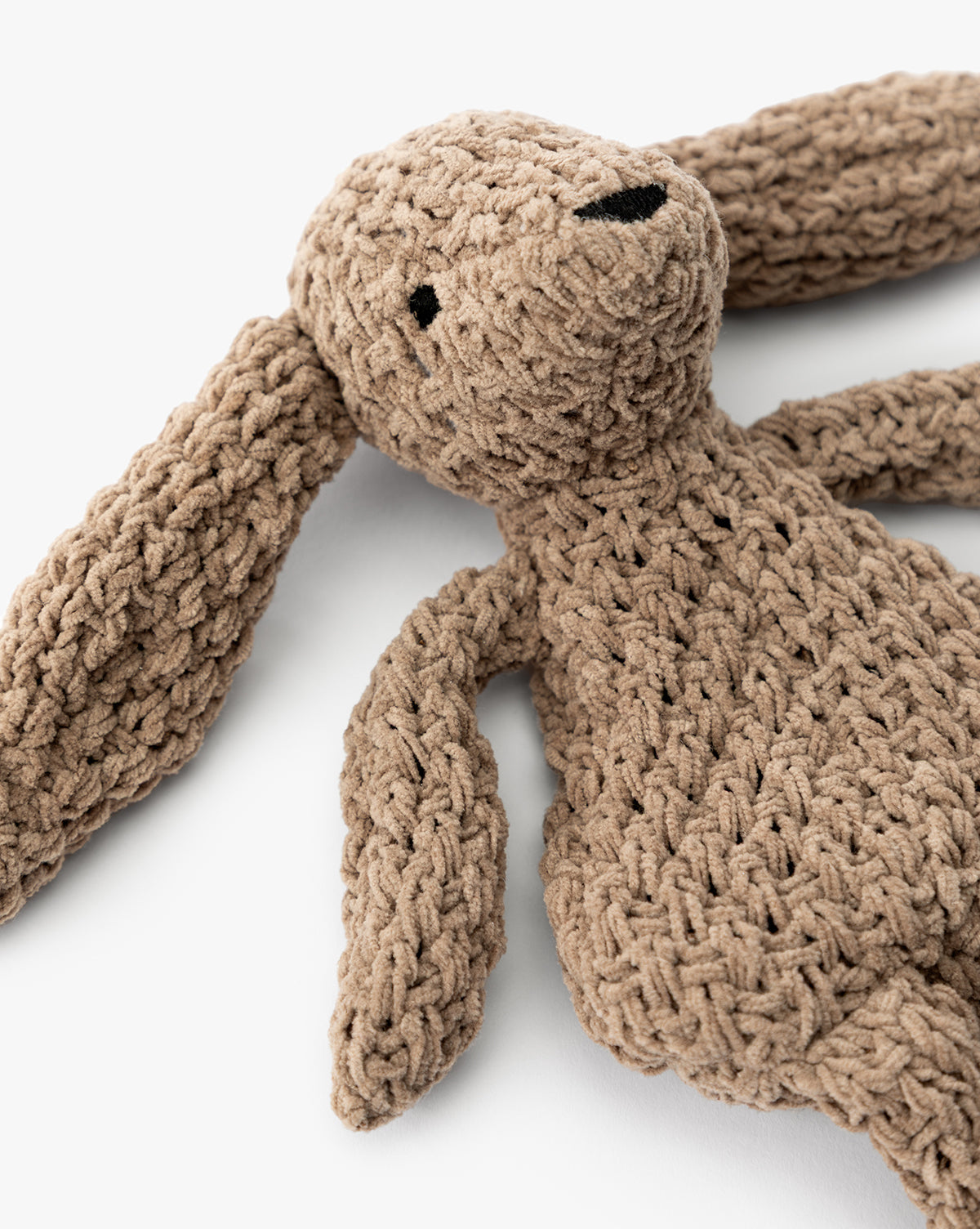 A close-up of Chenille Bunnies (Set of 2), featuring ultra-soft knit fabric, long floppy ears, black stitched eyes, and a simple nose—ideal for cozy nursery decor, by McGee & Co.