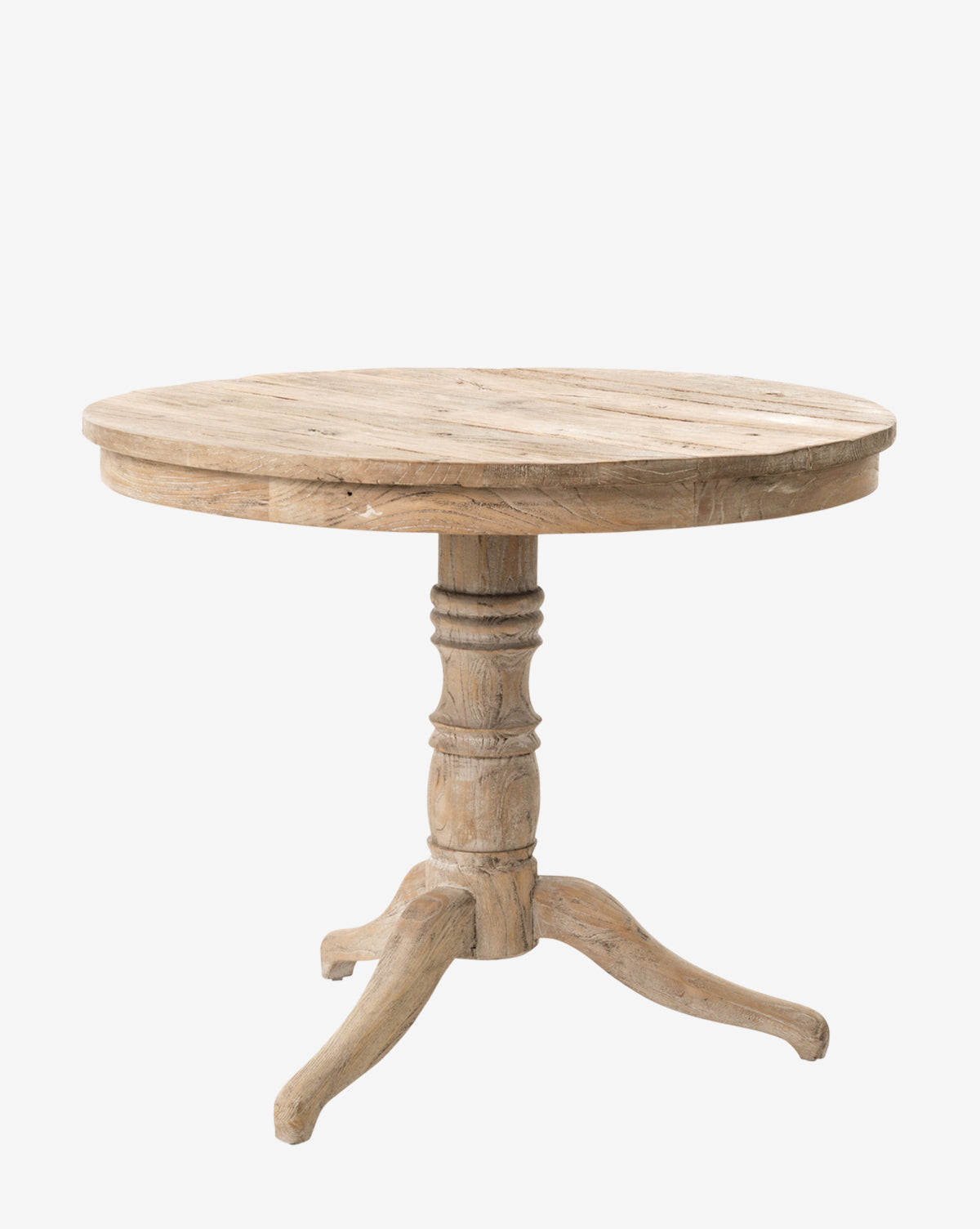 The Chloe Side Table features a round top, single ornate pedestal base with three curved feet, and is crafted from light-colored whitewashed wood. Inspired by French design, it showcases visible wood grain for added charm by McGee & Co.
