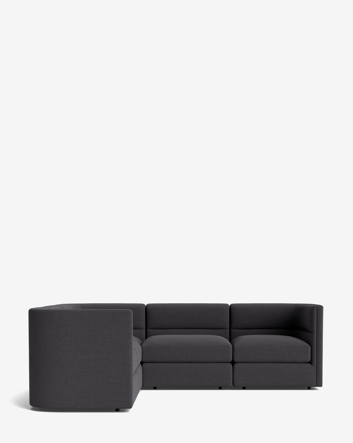 The Claremont Modular L Sectional 99 features a modern design with clean lines and low backrests in dark gray fabric, offering customizable flexibility and style for contemporary living spaces, shown here against a plain white background, by McGee & Co.