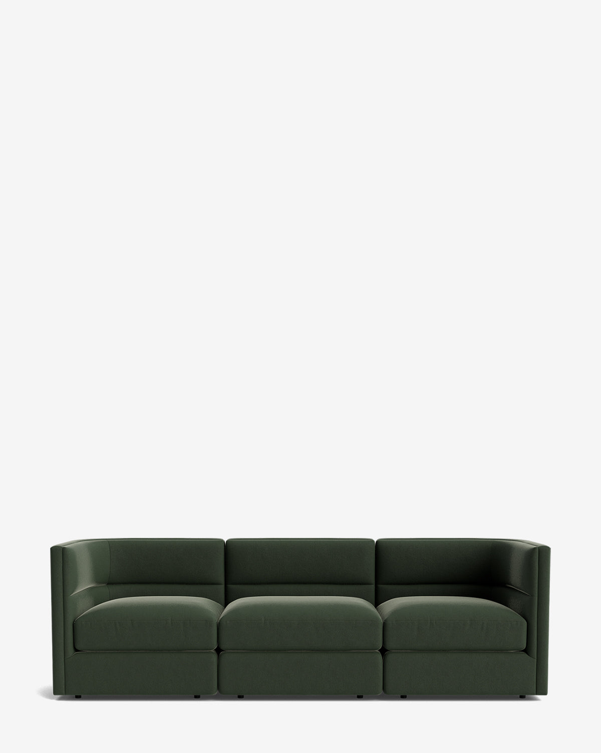 The Claremont Modular Sofa 99 is a modern, dark green sofa with luxurious comfort, a low backrest, and straight lines, shown against a plain white background by McGee & Co.
