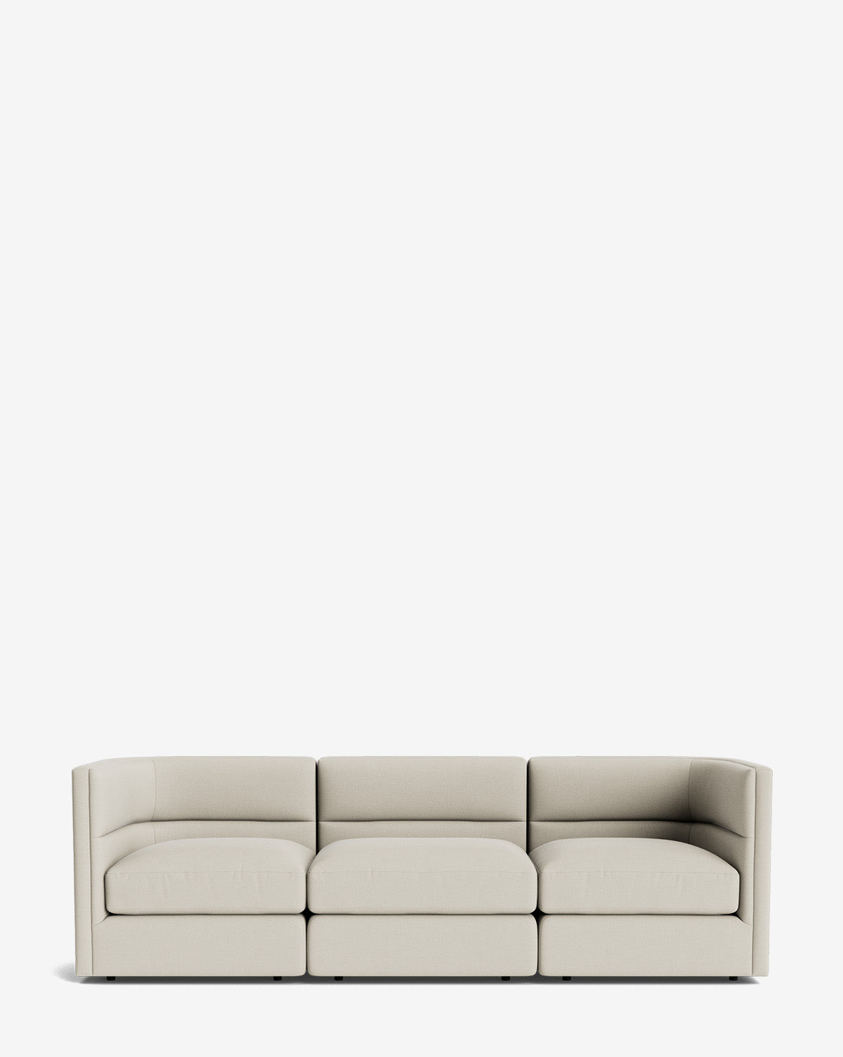 The Claremont Modular Sofa 99 is a modern, light beige three-seater with low, straight arms and plush cushions, set against a white background for luxurious comfort, by McGee & Co.