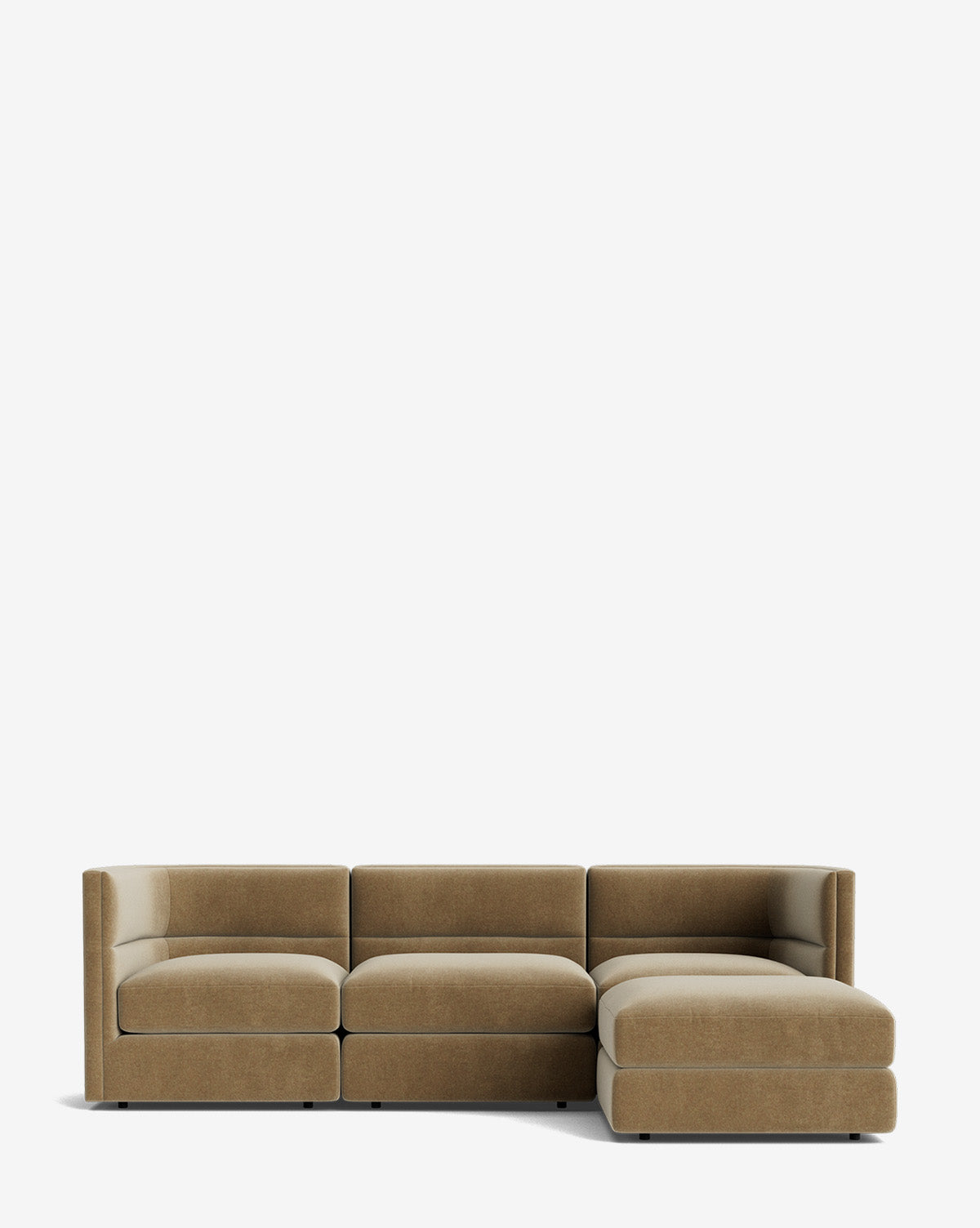 The Claremont Modular Sofa with Ottoman 99 is a modern, modular piece in light brown fabric featuring a channeled back, three seats, and a right-side chaise lounge, shown on a plain white background by McGee & Co.