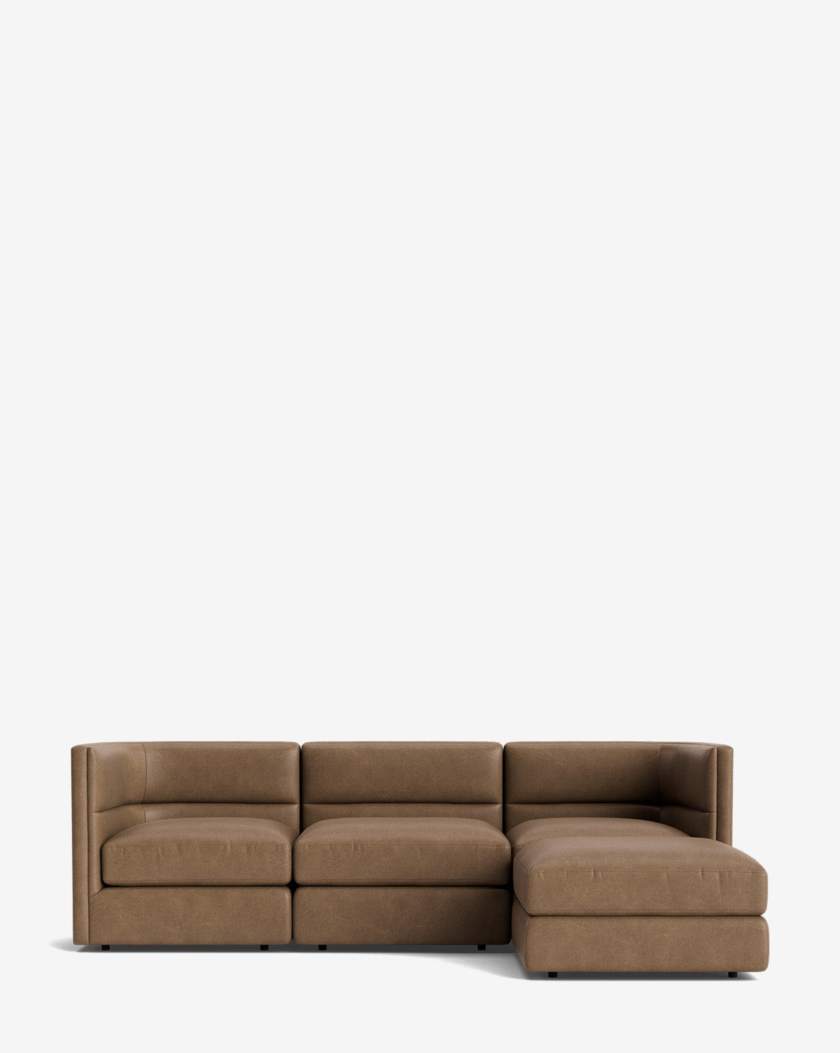 The Claremont Modular Sofa with Ottoman 99 is a modern brown piece featuring a channeled back, low armrests, three seats, and an extended right-side chaise, shown against a plain white background, by McGee & Co.