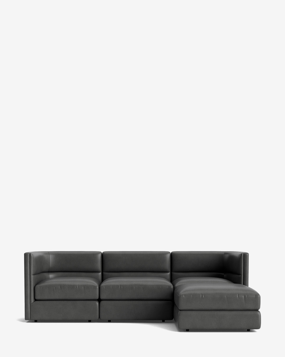 The Claremont Modular Sofa with Ottoman 99 features a modern dark gray design, three seats, and a right-facing chaise lounge, shown against a plain white background by McGee & Co.