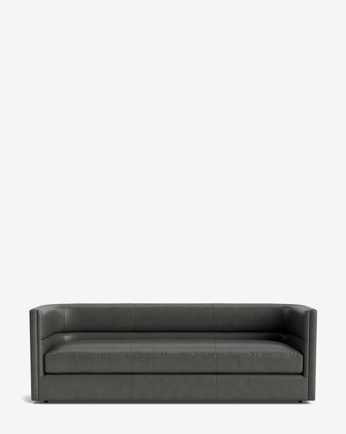 A modern Claremont Sofa 84 in dark gray, featuring low armrests and a minimalist design, crafted from high-quality fabric, set against a plain white background by McGee & Co.