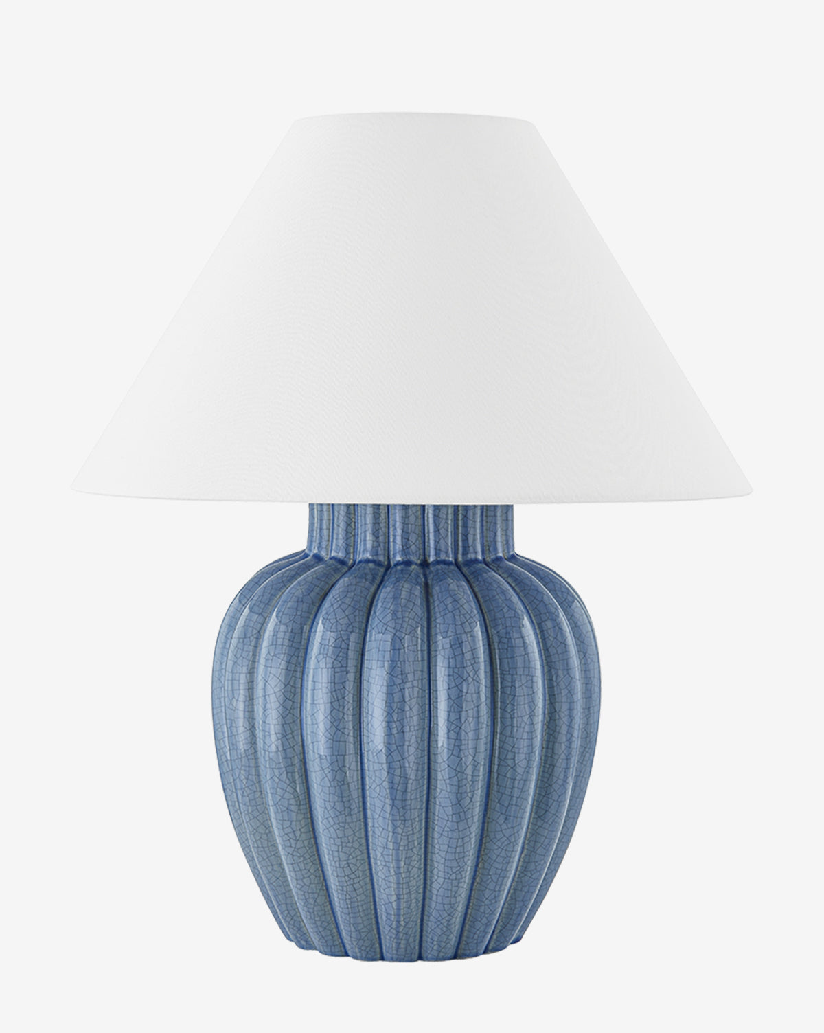 The Clarendon Table Lamp has a ribbed ceramic base with a vivid blue finish and a large white conical shade, displayed on a plain white background by McGee & Co.