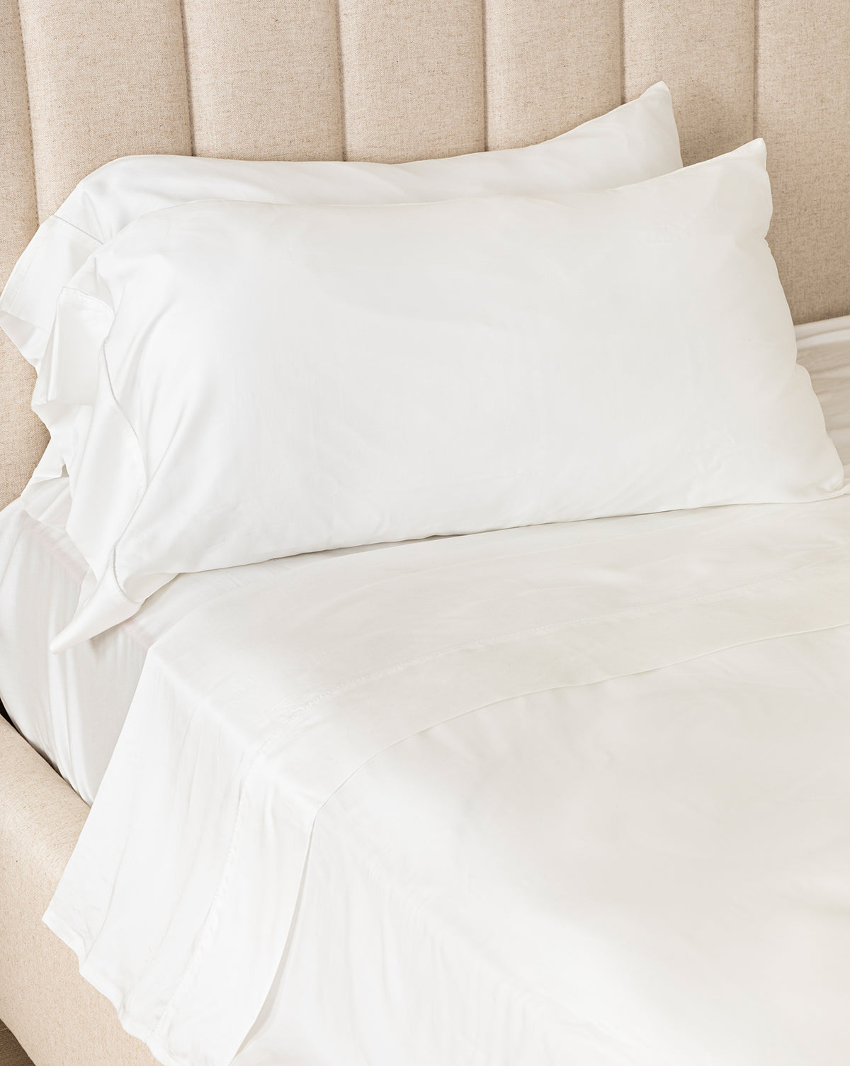 Queen Claussen Tencel sheets layered for a cozy, elegant bedroom retreat from McGee & Co.
