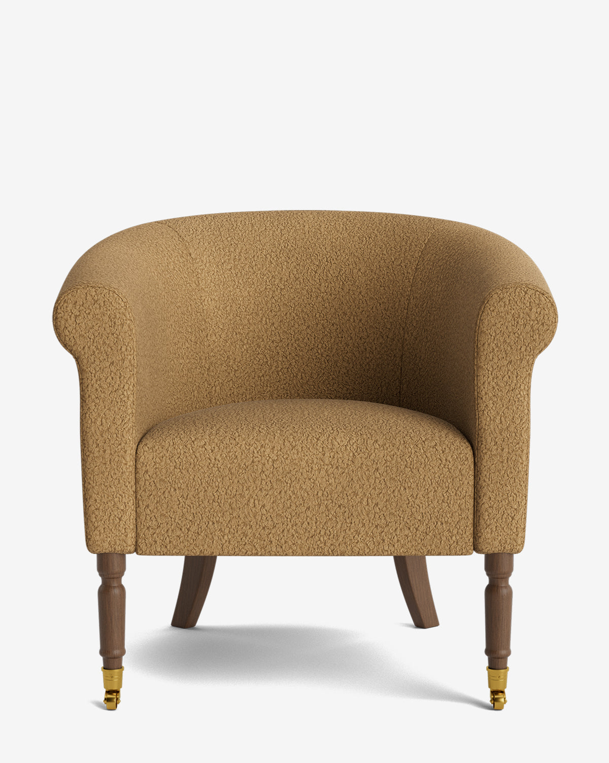 The Clemence Lounge Chair is a tan upholstered armchair with designer fabric, rounded arms, wooden legs, and brass caster wheels on the front legs, displayed against a plain white background by McGee & Co.