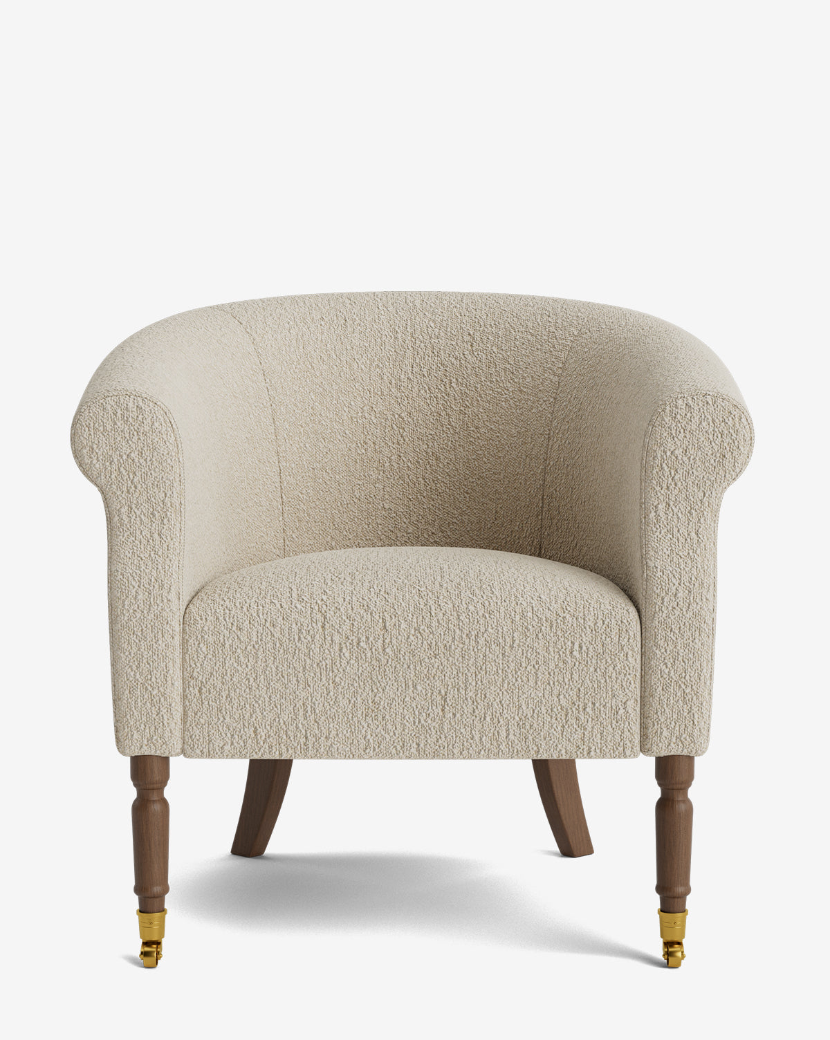 The Clemence Lounge Chair is cream-colored with textured upholstery, a rounded back, rolled arms, and wooden legs—front legs have brass casters, by McGee & Co. This classic living room chair is shown against a plain white background.