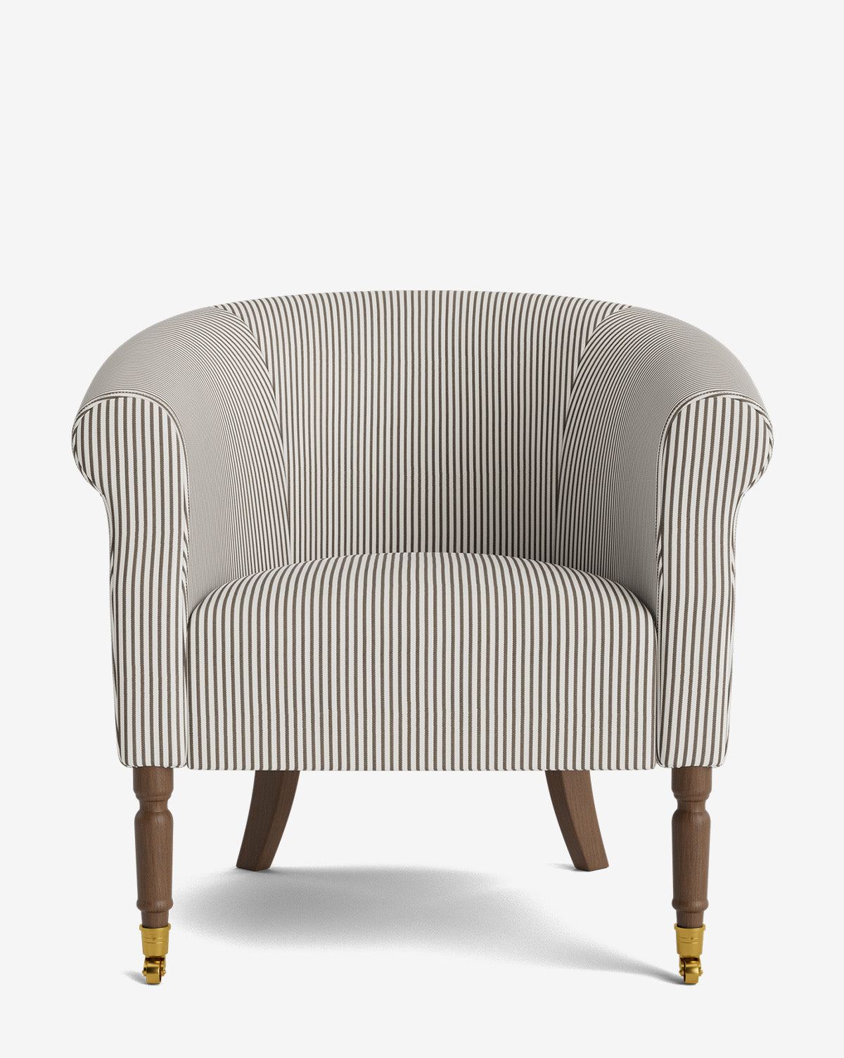 The Clemence Lounge Chair features striped designer fabric, rolled arms, wooden front legs with brass casters, and curved back legs, all showcased against a plain white background by McGee & Co.