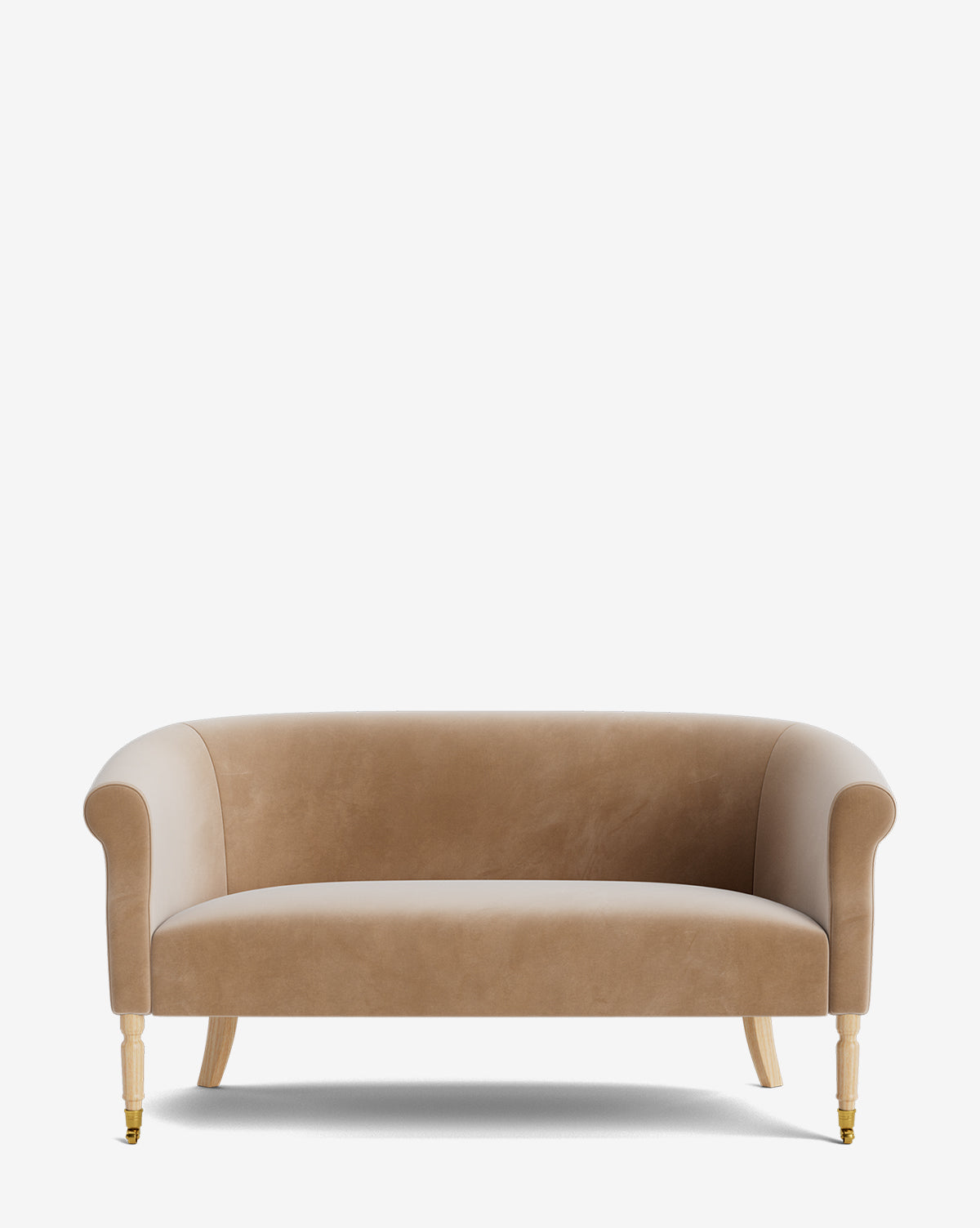 The Clemence Settee 60 by Makerspalm features light brown velvet upholstery, rounded arms, curved backrest, and light wood legs with front brass castors—an elegant addition to any living space. McGee & Co.