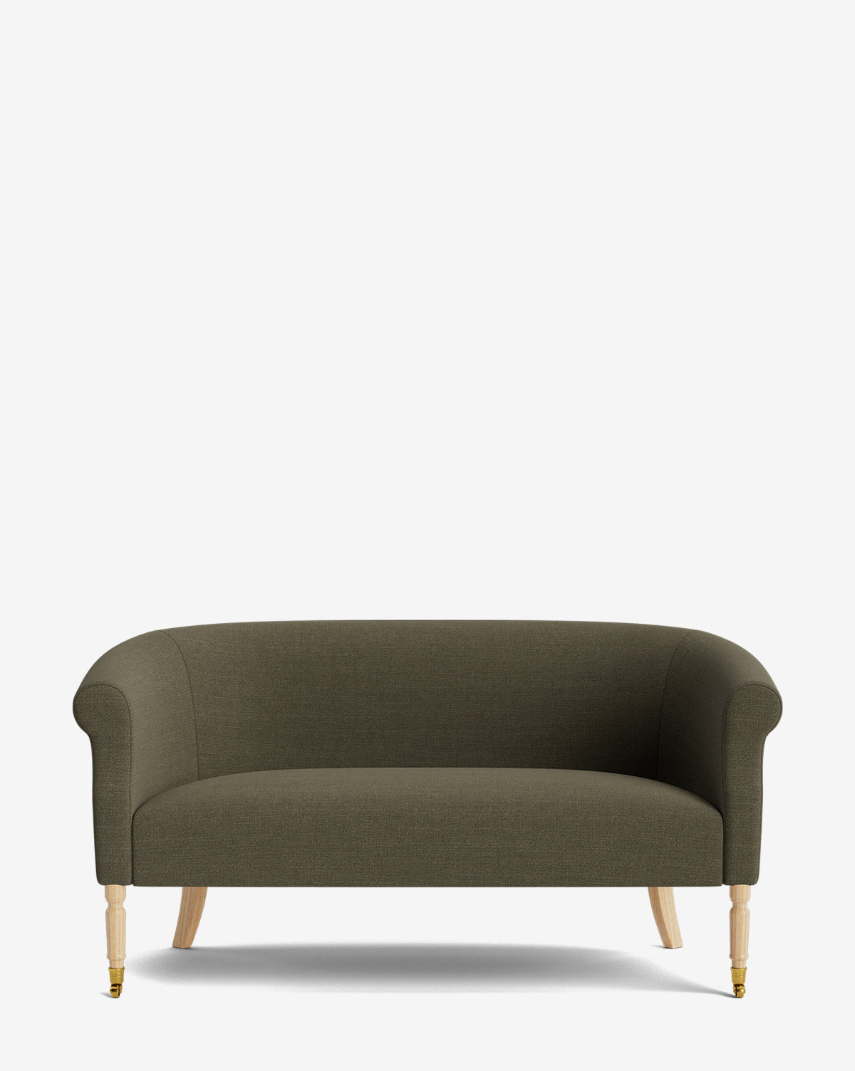 The Clemence Settee 60 by Makerspalm features green designer fabric upholstery, rounded arms, and wooden legs—front legs with brass castors and plain back legs—making it a stylish addition to any living space by McGee & Co.