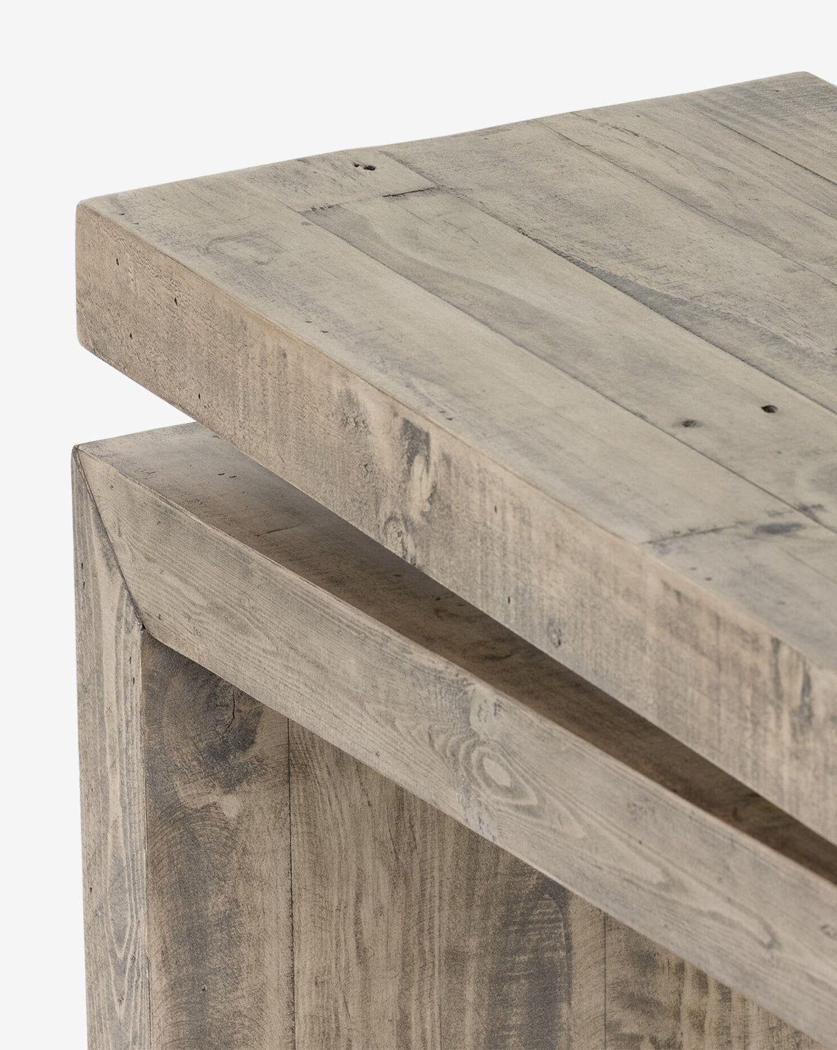 Close-up of the Colter Console Table corner, crafted from reclaimed wood in weathered light brown with visible knots and rich texture—highlighting the overlapping tabletop and leg detail for a modern entryway look, by McGee & Co.
