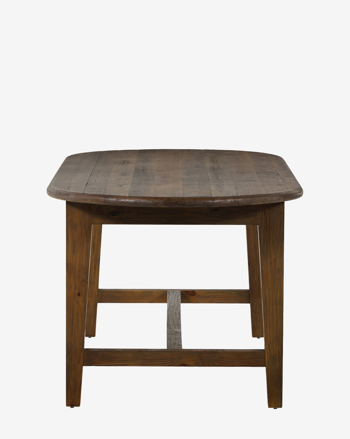 The Constance Dining Table, crafted from solid pine with a dark finish and visible wood grain, features sturdy legs and a crossbar, adding modern farmhouse charm to any space, by McGee & Co.