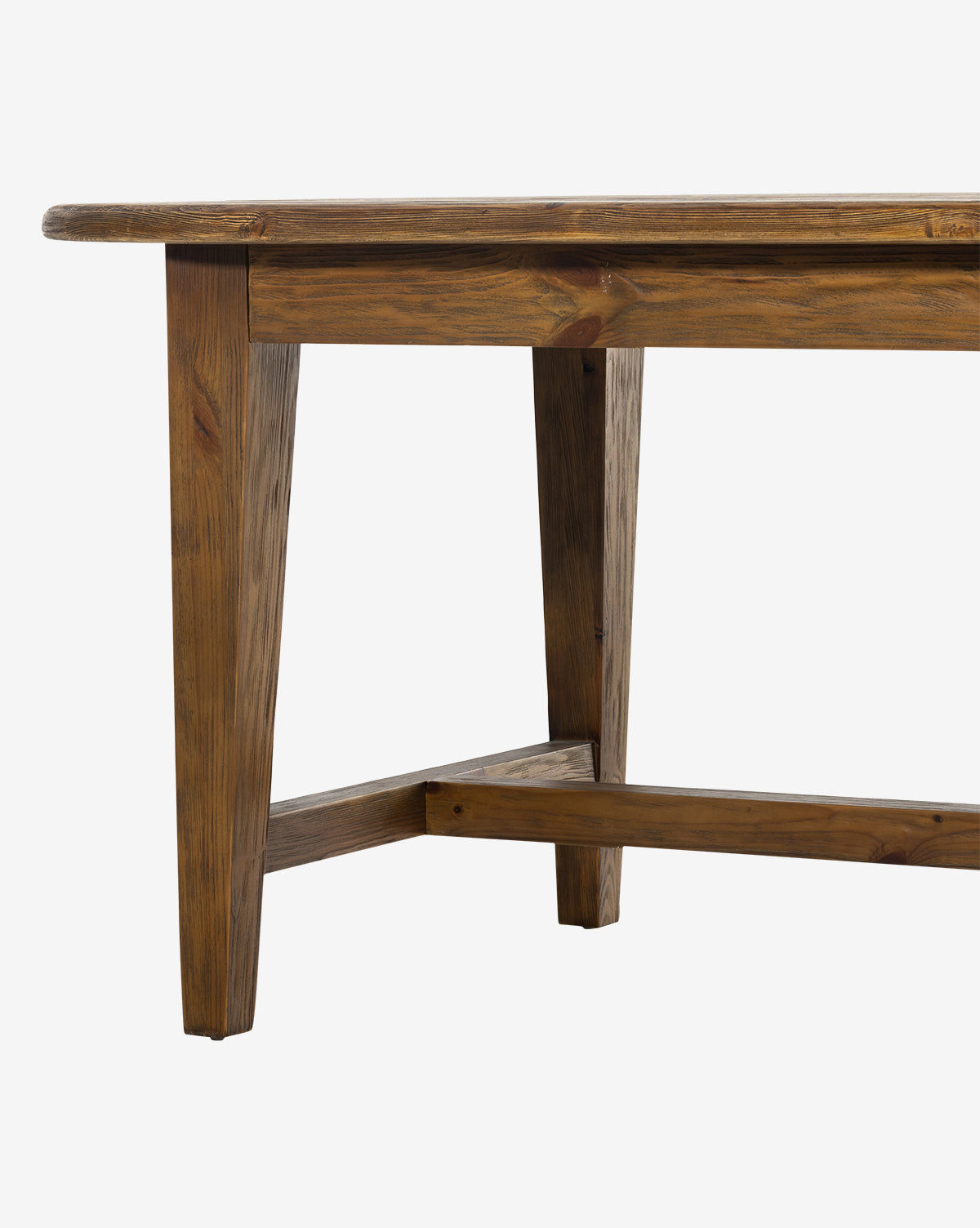 The Constance Dining Table features a rectangular solid pine top with natural wood grain, angled legs, and a crossbar for added stability—an ideal centerpiece for any modern farmhouse dining room, by McGee & Co.