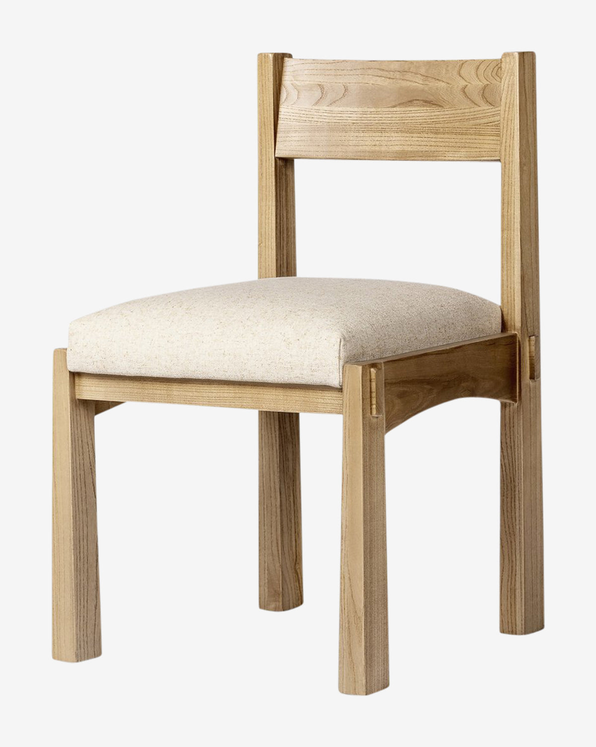 The Cyprian Dining Chair offers a cushioned seat in light beige performance fabric, straight legs, and a modern rectangular backrest—an ideal choice to update any dining room with simple, contemporary style, by McGee & Co.