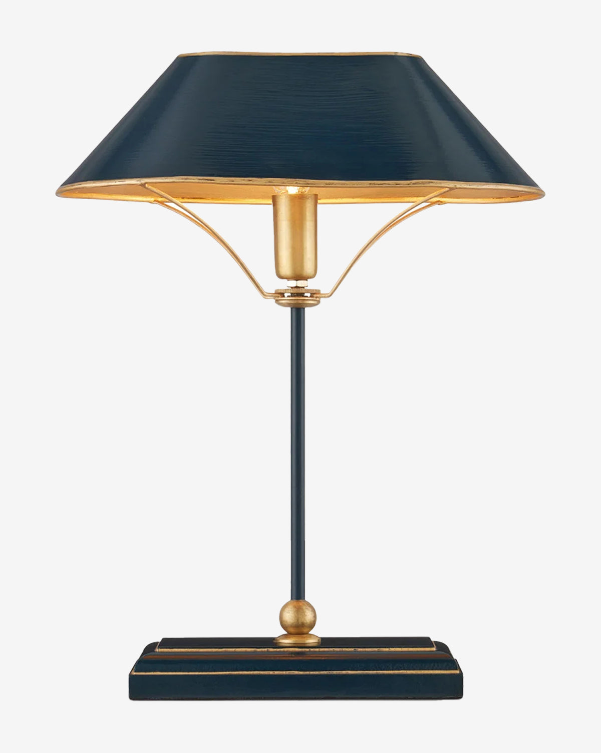 The Daphne Navy Table Lamp features a wide navy shade with a gold interior, a slim metal stem, and a rectangular base with gold accents. Shown unlit, the lamp is photographed against a plain white background by McGee & Co.