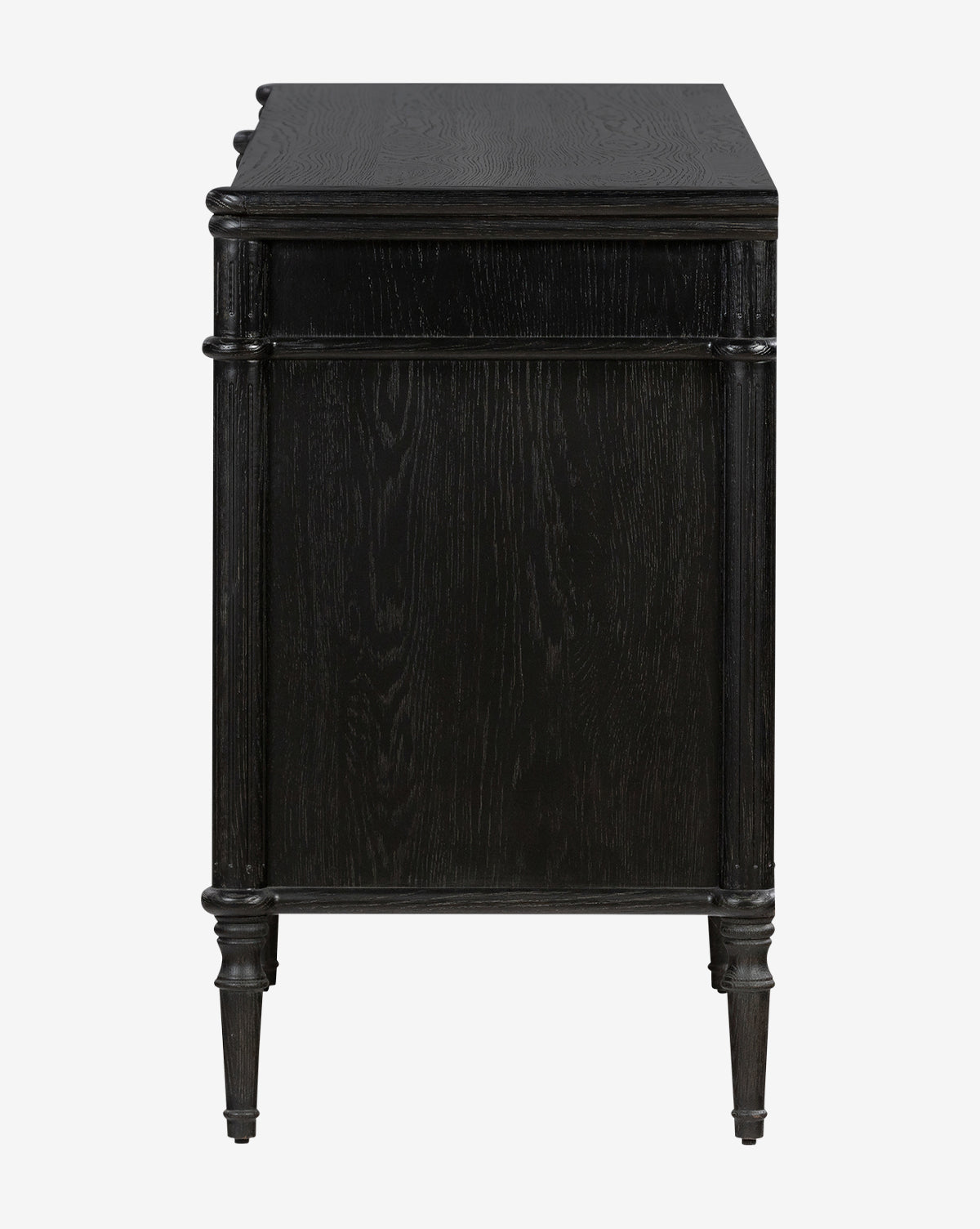 Side view of the Dixon Sideboard, a dark wood cabinet with paneled design, decorative legs, and aged brass hardware, shown against a plain white background, by McGee & Co.
