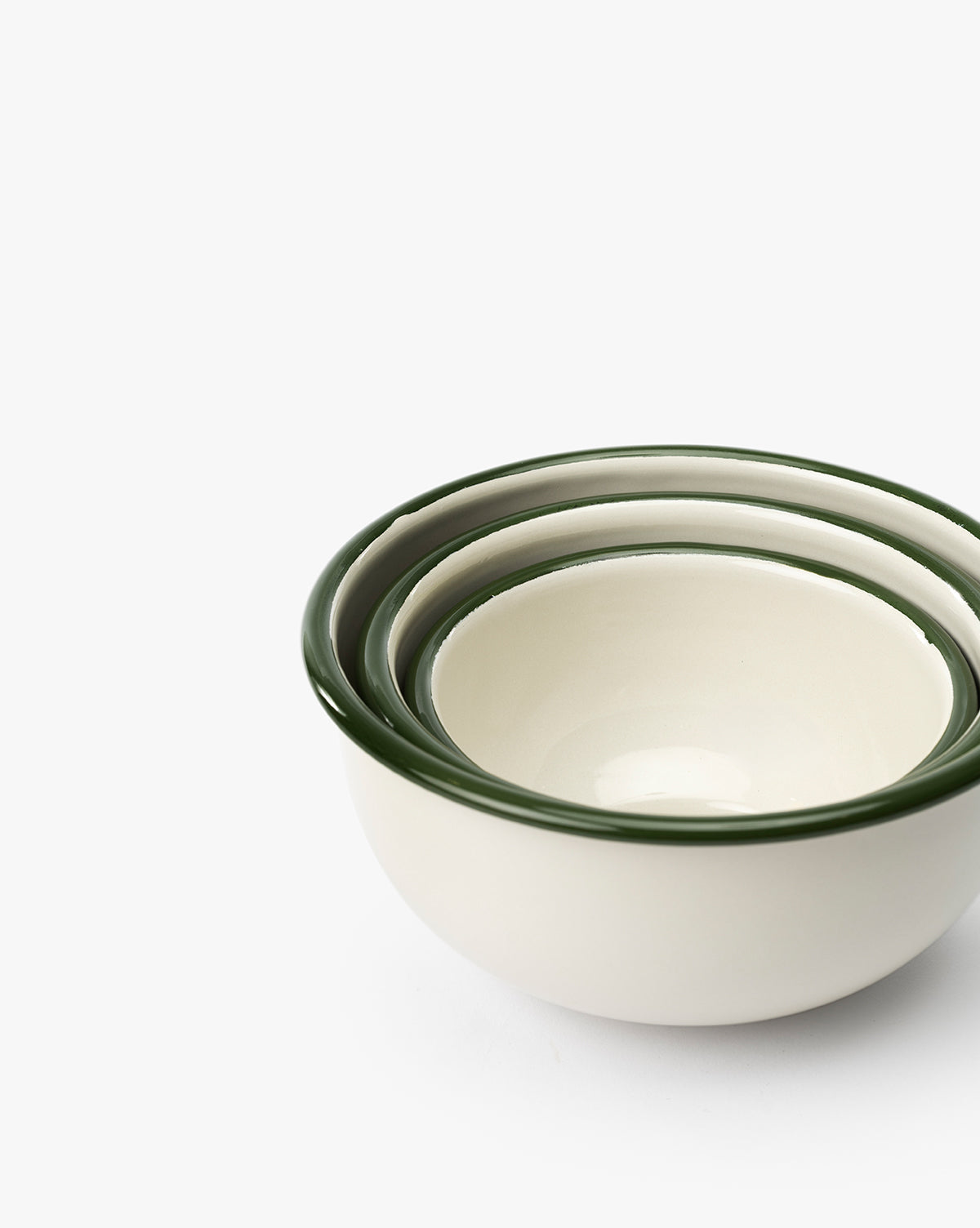The Delia Bowls (Set of 3) features white stoneware bowls with dark green rims, nested together against a white background for a charming, vintage-inspired addition to your kitchen, by McGee & Co.