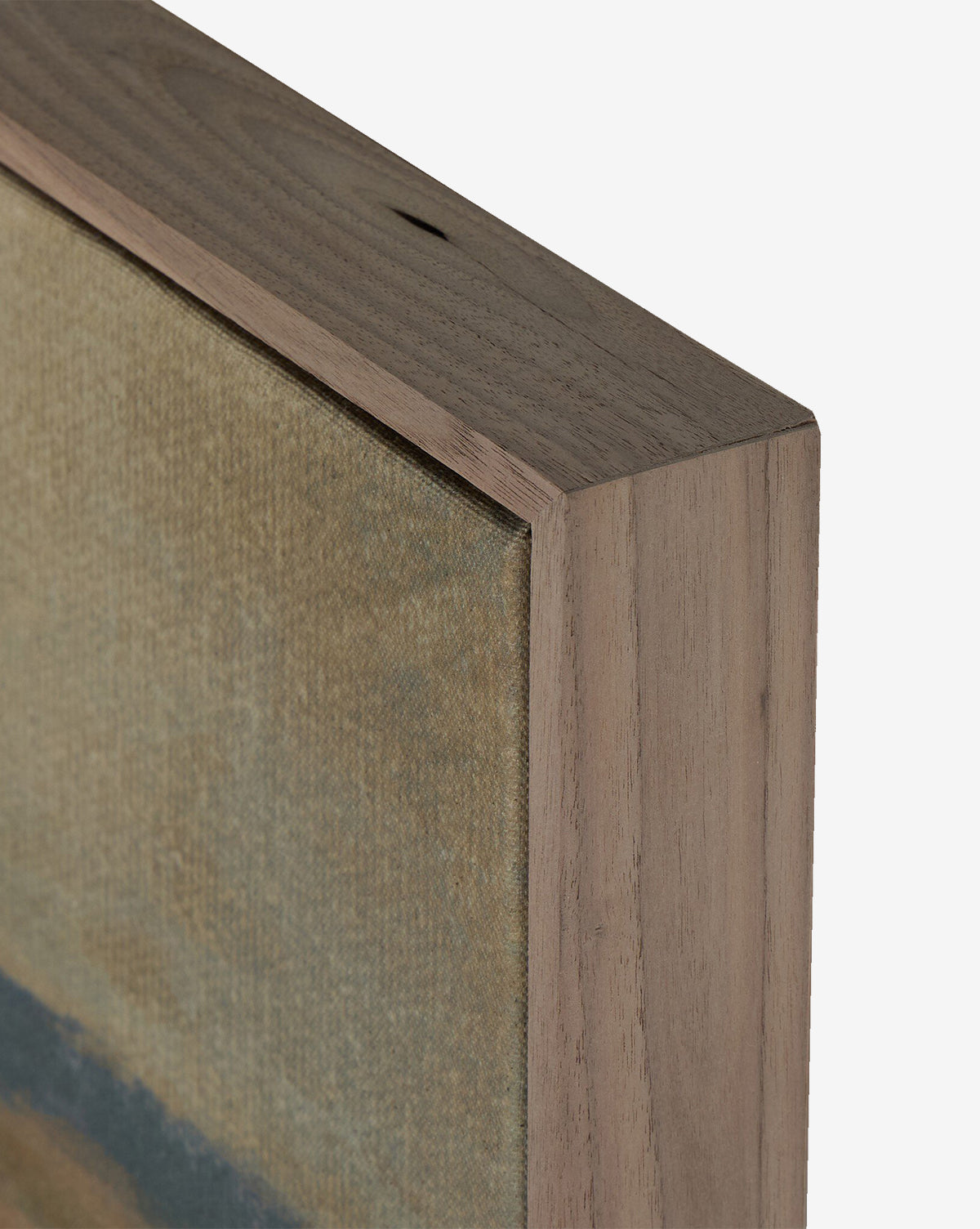 Close-up of the corner of Desert Hues II by Aileen Fitzgerald, showcasing the wood grain frame and part of the canvas with muted beige and blue tones, by McGee & Co.