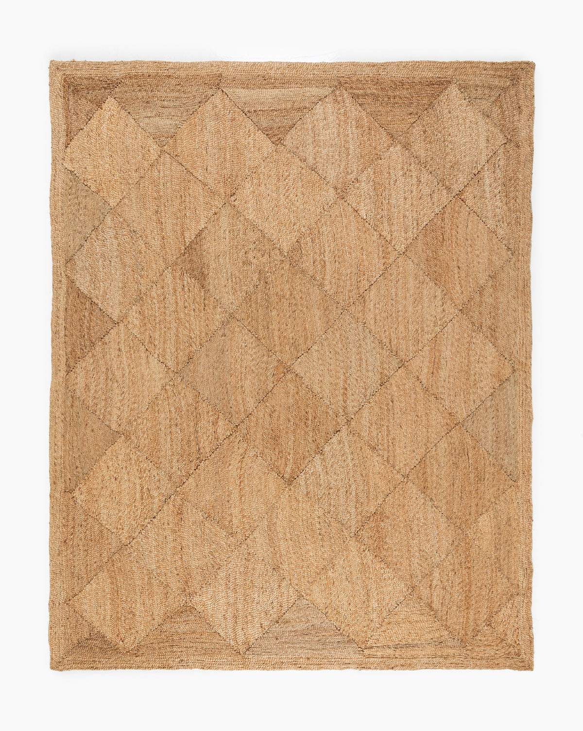 The Diamond Braided Jute Rug is a square, hand-woven rug with a geometric diamond pattern and textured design in tan and beige shades, crafted from natural jute fibers, by McGee & Co.