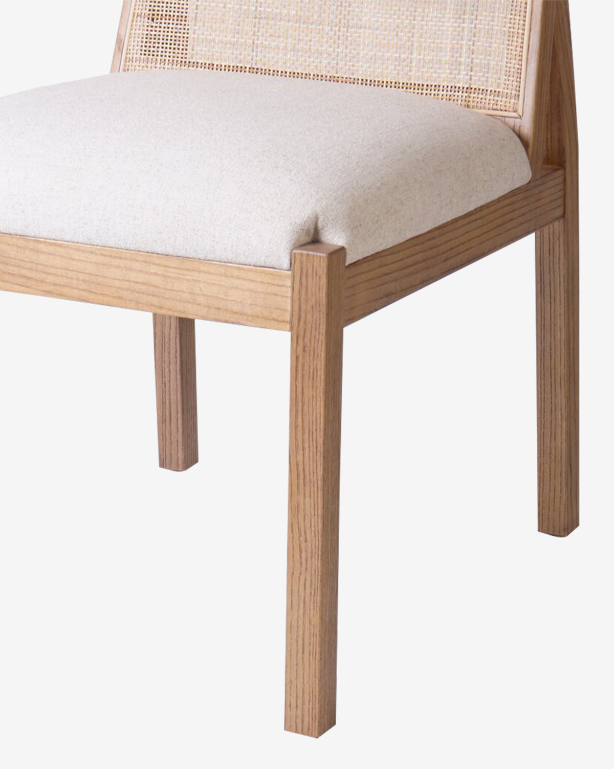The Eira Dining Chair features a performance fabric seat, woven cane back, clean lines, visible natural wood grain, and light beige upholstery, by McGee & Co.