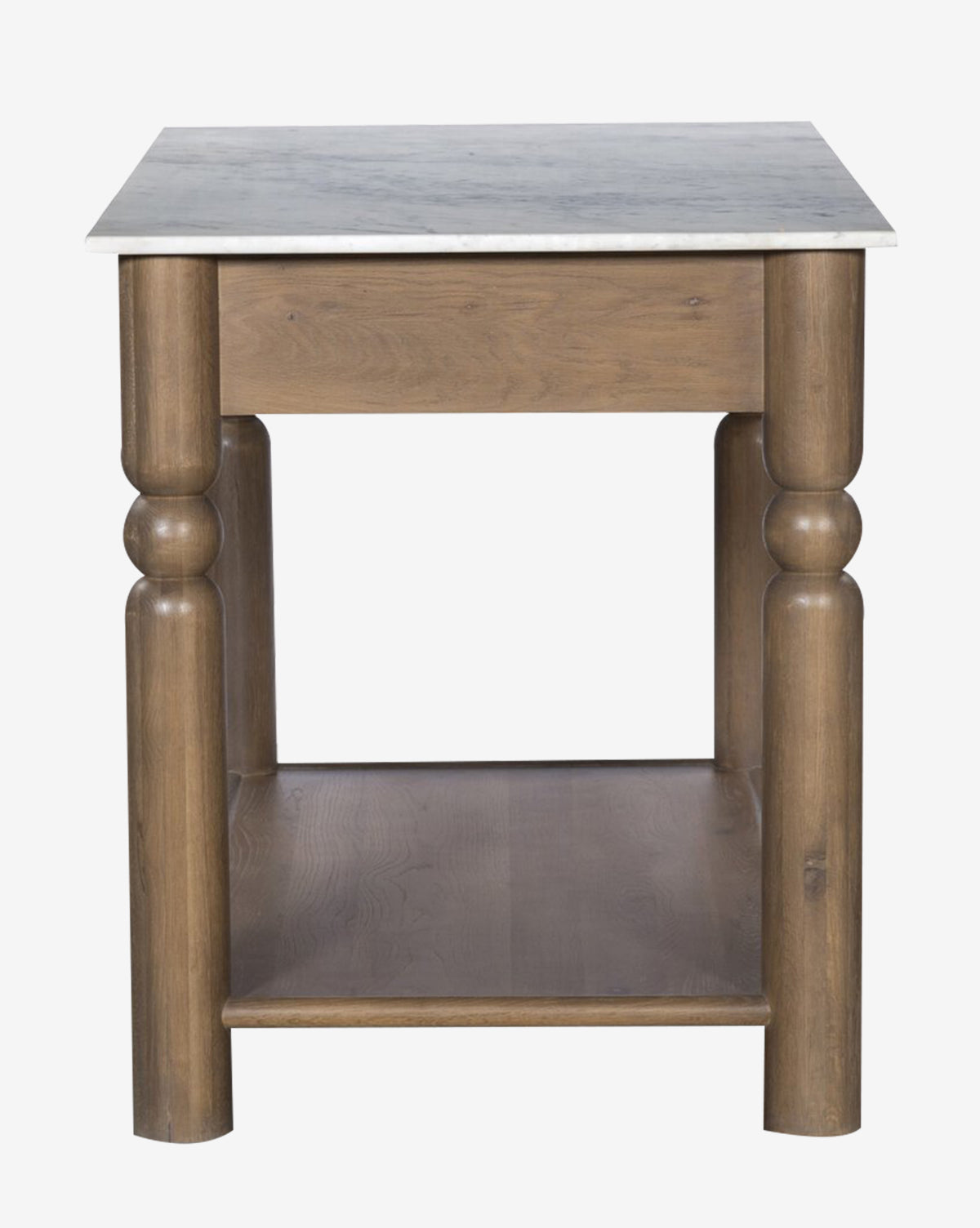 The Eldric Kitchen Island features a solid oak base, thick rounded legs, a white marble top, and a lower shelf—shown from the front against a plain background by McGee & Co.