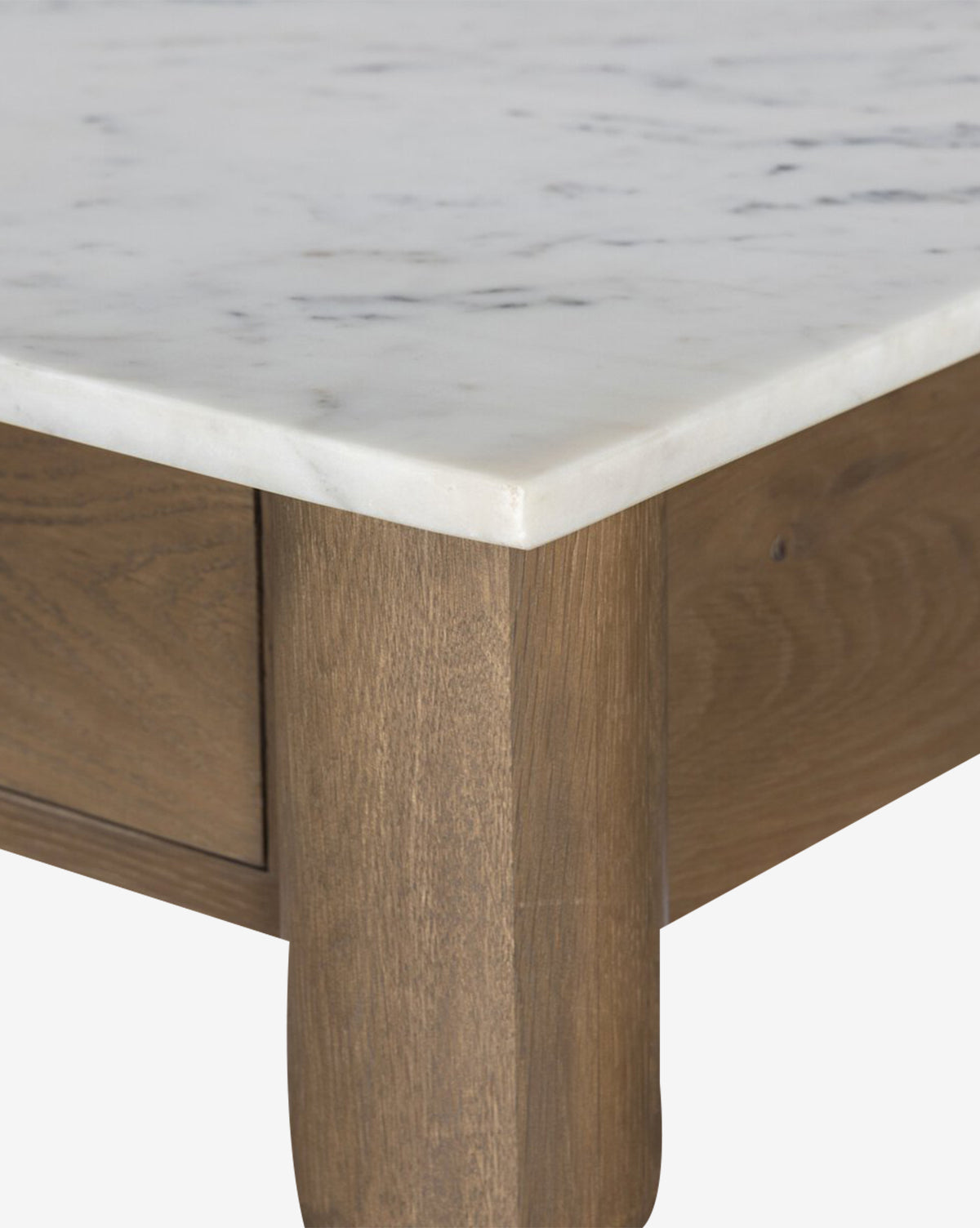 Close-up of the Eldric Kitchen Island’s corner, showcasing a white marble top with subtle gray veining paired with a light brown solid oak base and frame, by McGee & Co.