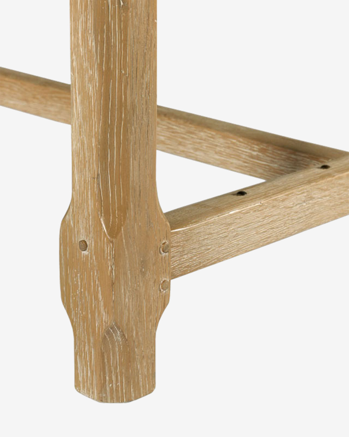 Close-up of the Elliot Extension Dining Tables corner, showcasing its natural wood finish and the precise right-angle joint where two pieces meet, by McGee & Co.