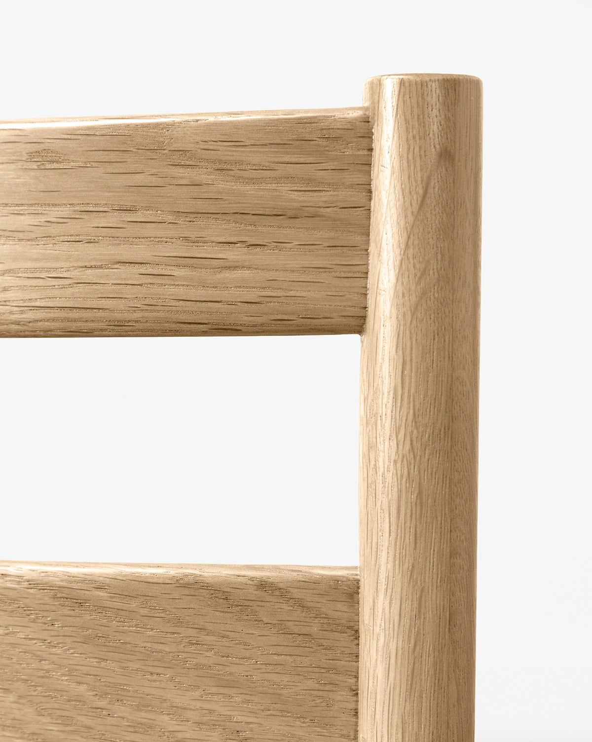 Close-up of the Eloise Woven Counter Stool’s light wood backrest, highlighting Danish-inspired design with two horizontal slats, a vertical post, and a smooth finish set against a clean white background, by McGee & Co.