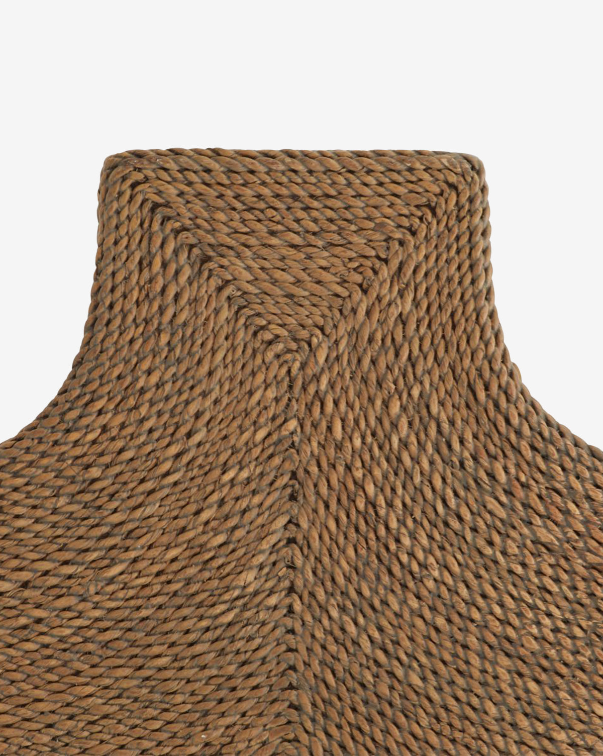 Close-up of the Elysia Mirror’s handwoven brown wicker frame, crafted with abaca rope in a textured diagonal chevron pattern. Natural fibers are tightly braided for a sturdy, detailed finish. Set against a plain white background by McGee & Co.